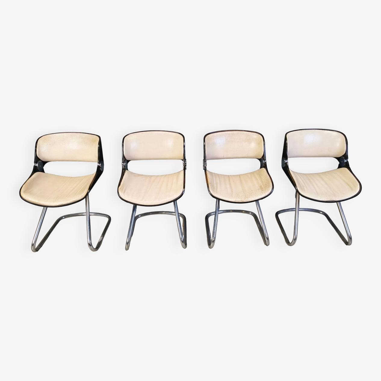 Set of four Arpege chairs, beige leather, plywood, chromed metal, by É. Fermigier, France, 1970s. - 331605