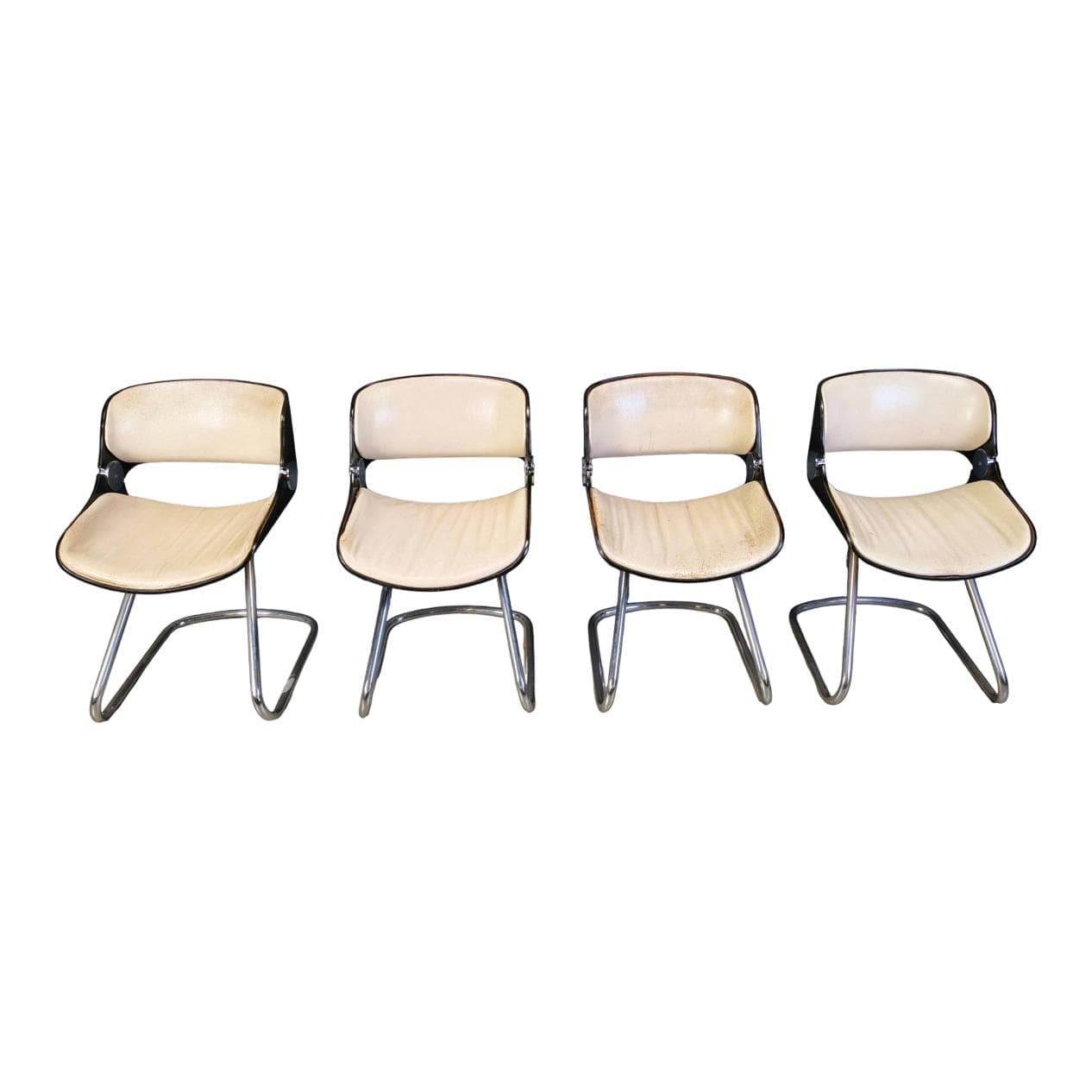 Set of four Arpege chairs, beige leather, plywood, chromed metal, by É. Fermigier, France, 1970s.