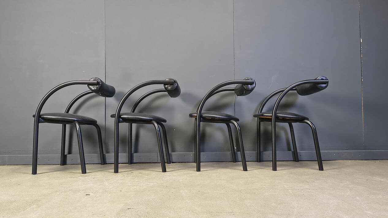 Set of four postmodern dining chairs, black metal, black leatherette, Italy, 1980s. - 331019