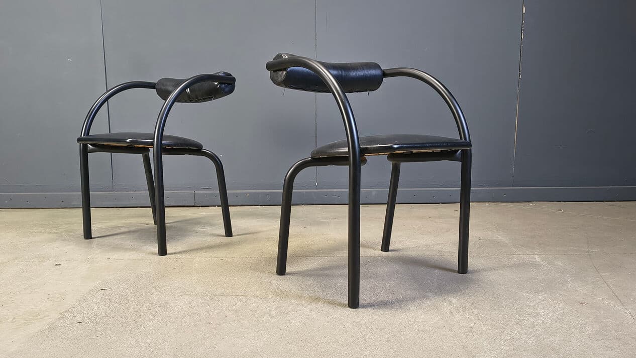 Set of four postmodern dining chairs, black metal, black leatherette, Italy, 1980s. - 331023