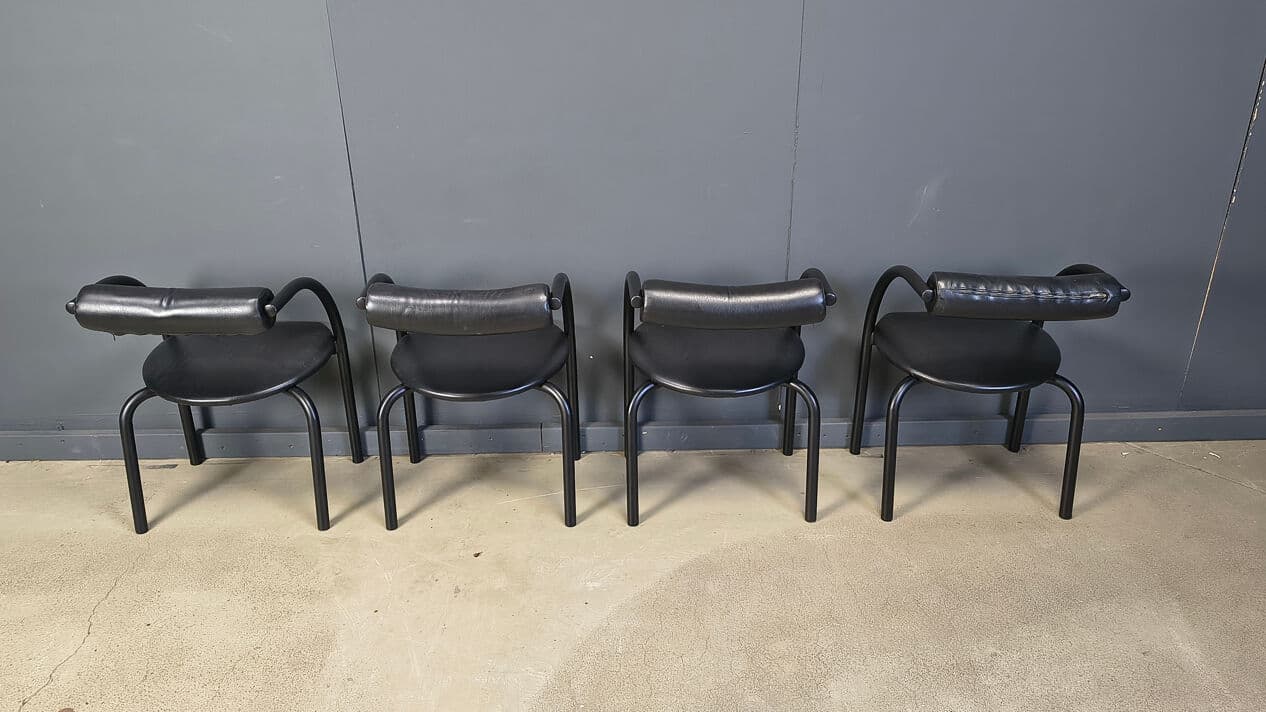 Set of four postmodern dining chairs, black metal, black leatherette, Italy, 1980s. - 331020
