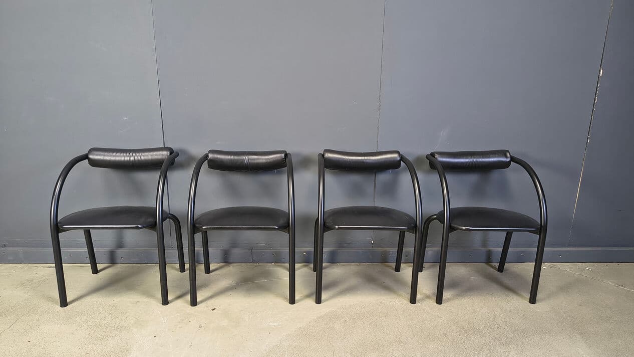 Set of four postmodern dining chairs, black metal, black leatherette, Italy, 1980s. - 331014