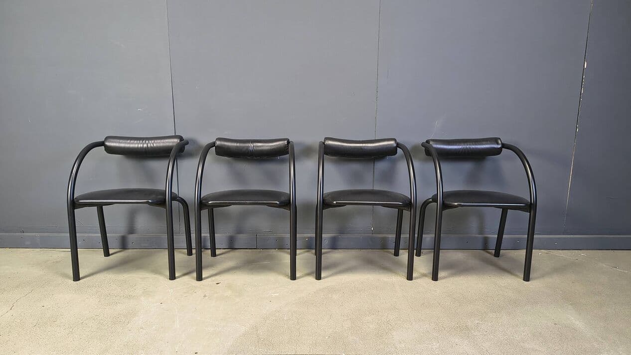 Set of four postmodern dining chairs, black metal, black leatherette, Italy, 1980s. - 331017