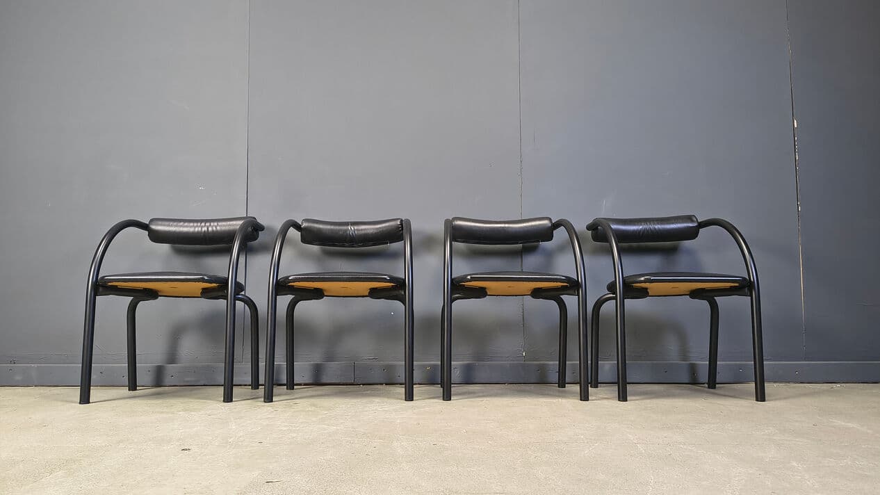 Set of four postmodern dining chairs, black metal, black leatherette, Italy, 1980s. - 331021
