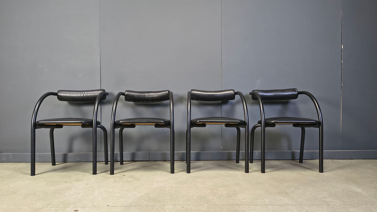 Set of four postmodern dining chairs, black metal, black leatherette, Italy, 1980s. - 331018