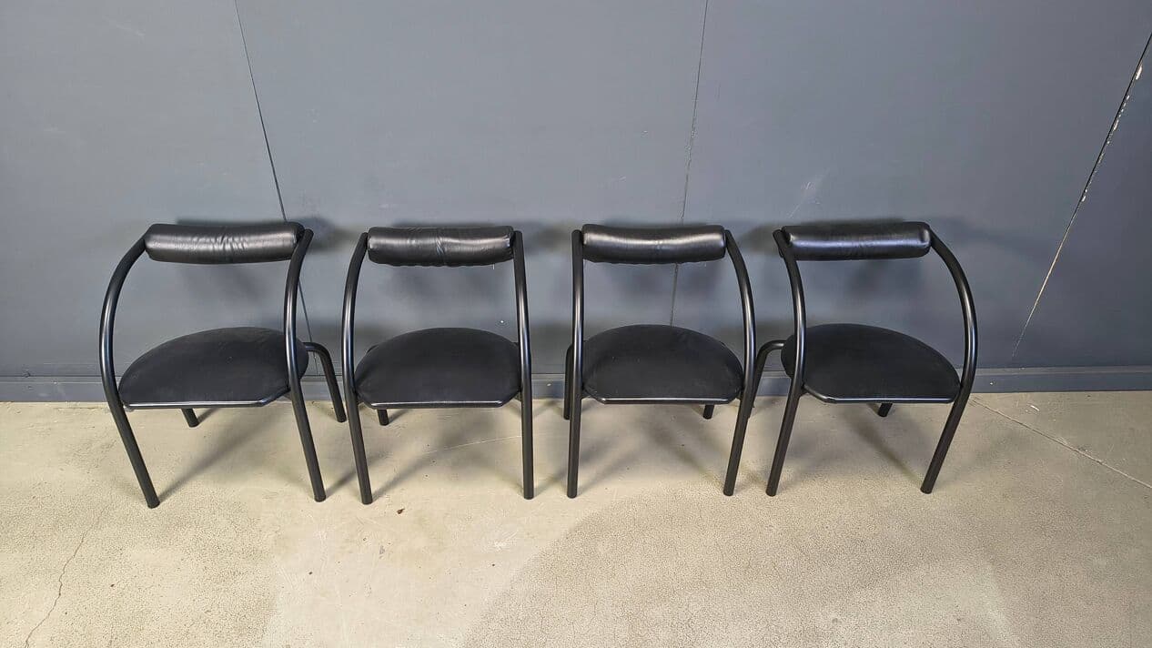 Set of four postmodern dining chairs, black metal, black leatherette, Italy, 1980s. - 331015