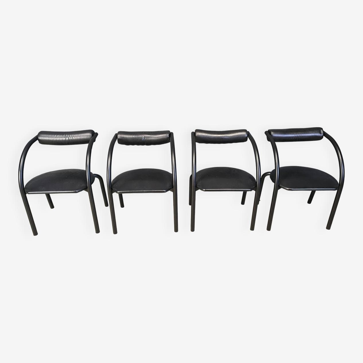 Set of four postmodern dining chairs, black metal, black leatherette, Italy, 1980s. - 331016