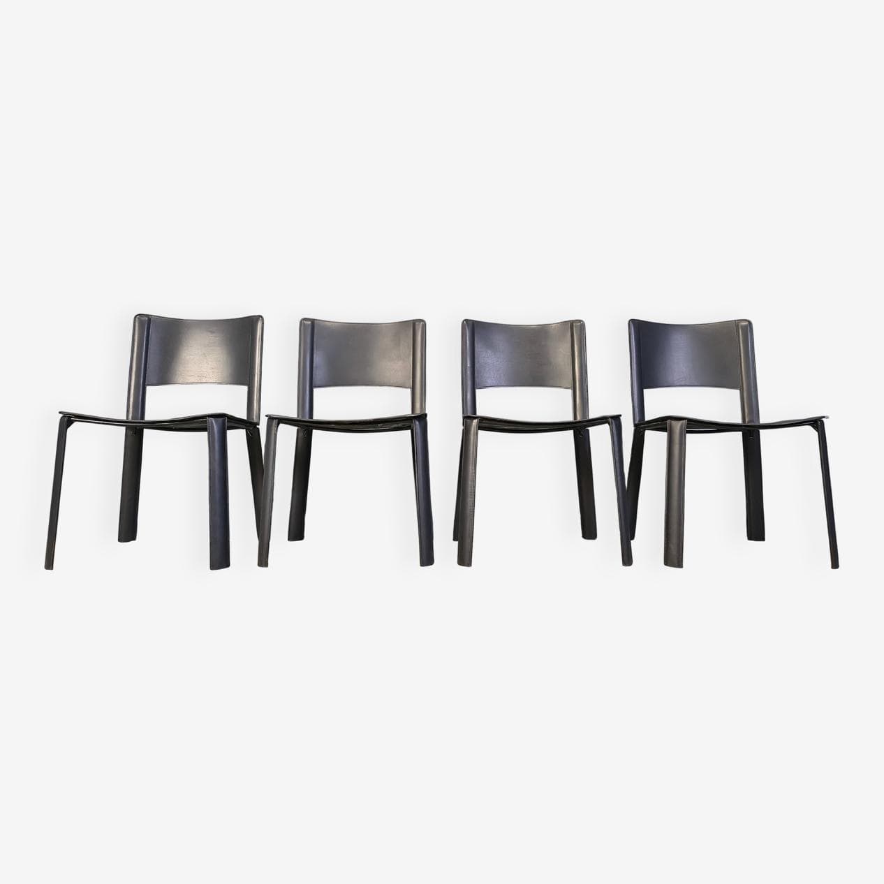 Set of four dining chairs, black leather, Italy, 1980s. - 330957