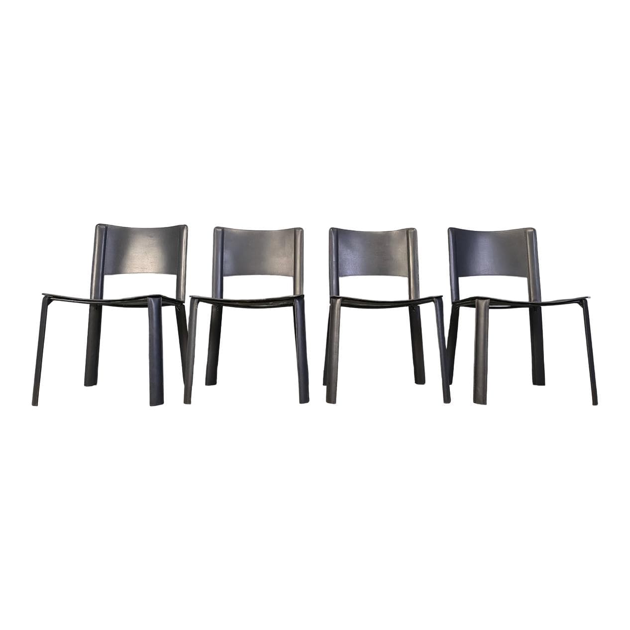 Set of four dining chairs, black leather, Italy, 1980s.