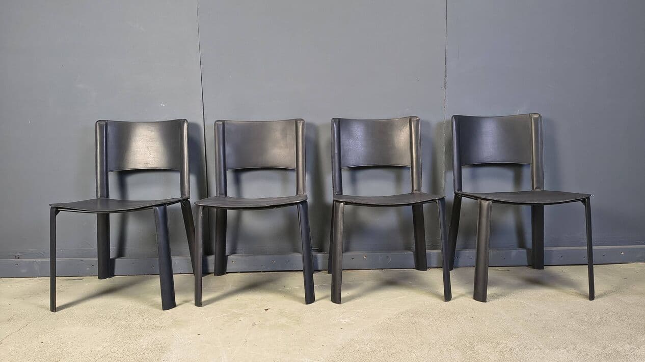 Set of four dining chairs, black leather, Italy, 1980s. - 330959