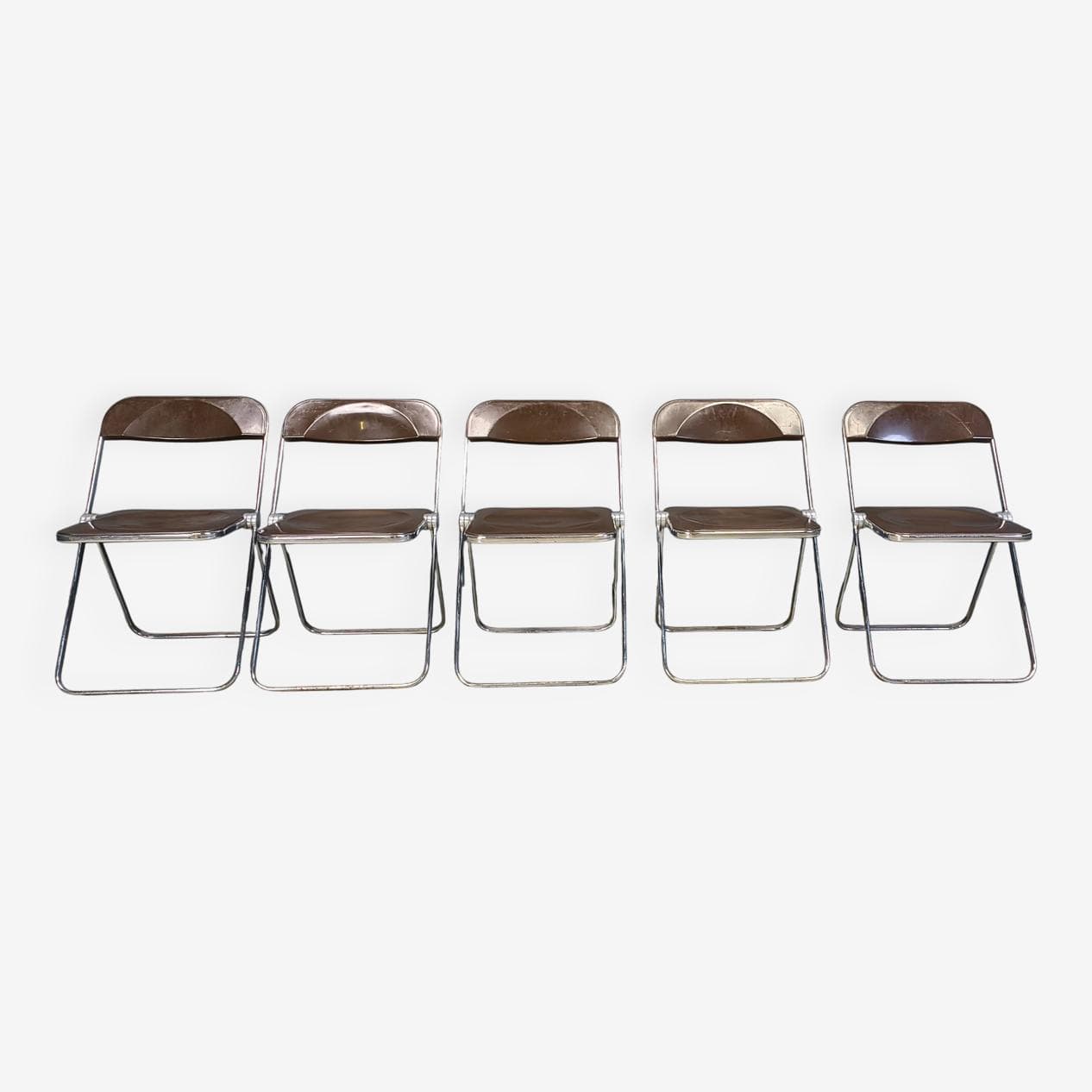 Set of five folding chairs Plia, transparent brown plastic, chrome, by G. Piretti, Castelli, Italy, 1970s. - 330910