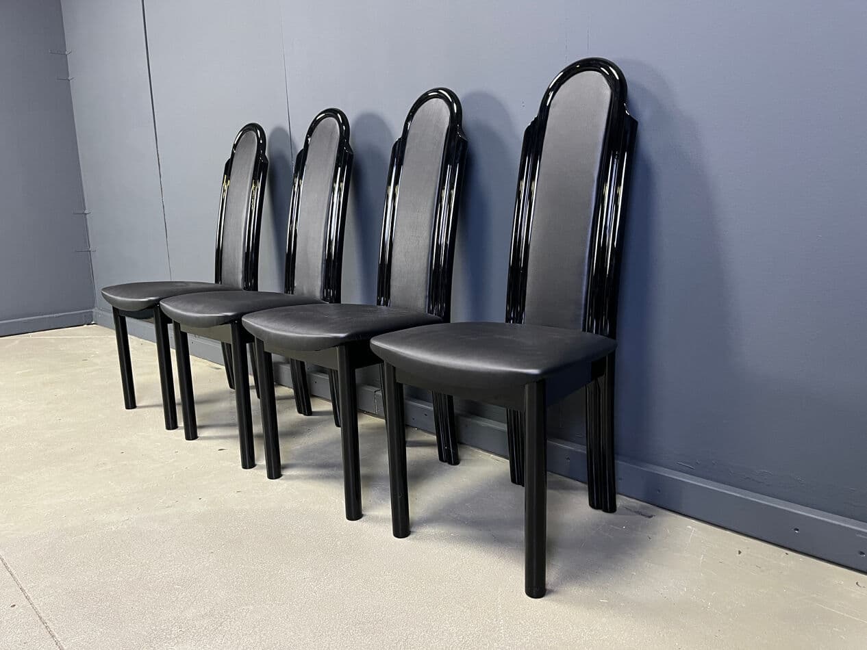 Set of four postmodern dining chairs, black wood, black faux leather, Italy, 1980s. - 330341