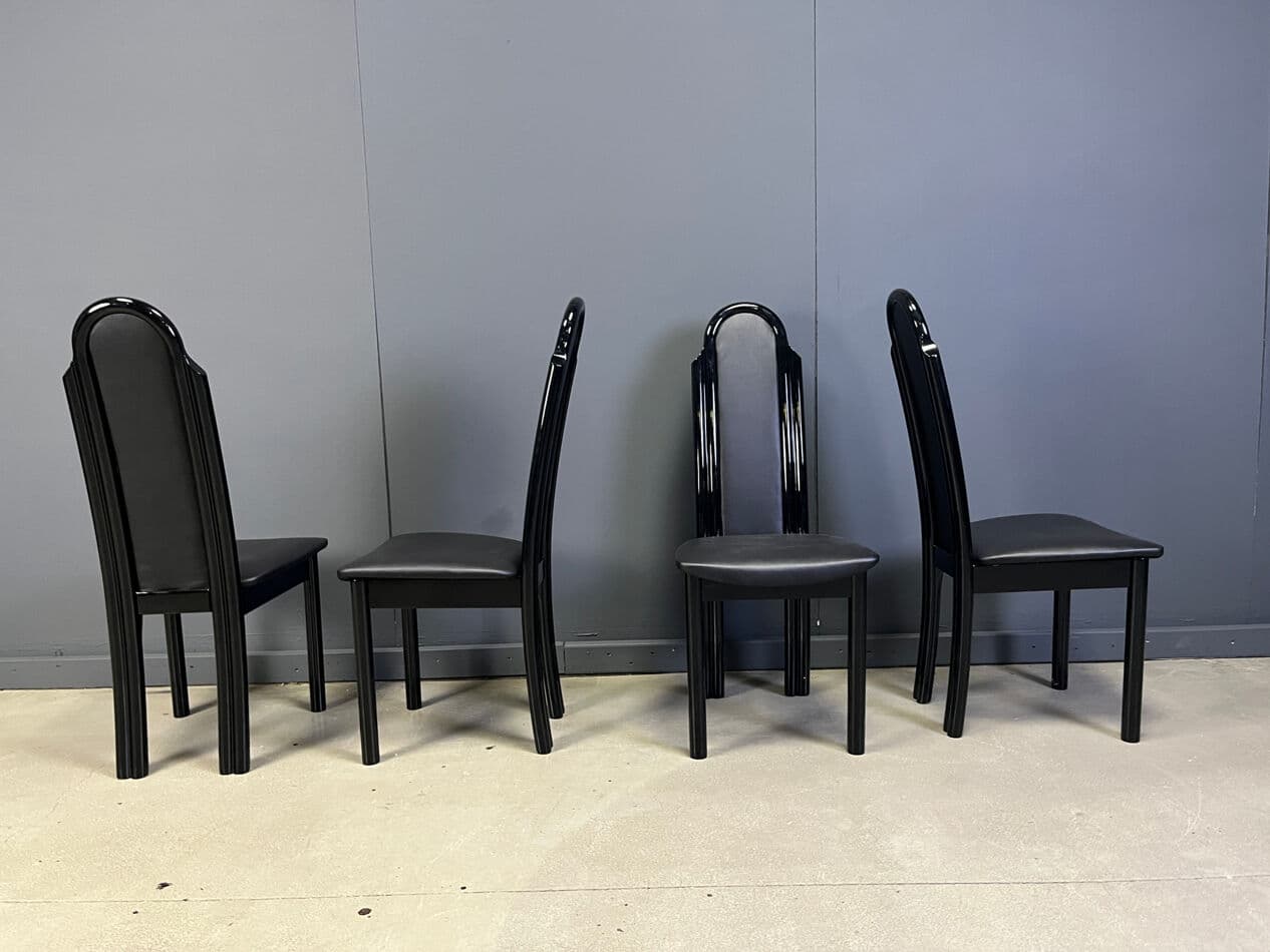 Set of four postmodern dining chairs, black wood, black faux leather, Italy, 1980s. - 330337
