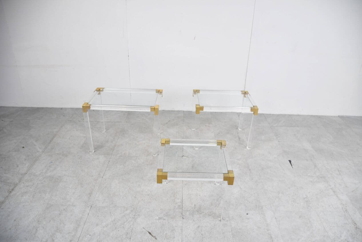 Set of three nesting tables, transparent lucite, brass, glass, Belgium, 1970s. - 329421