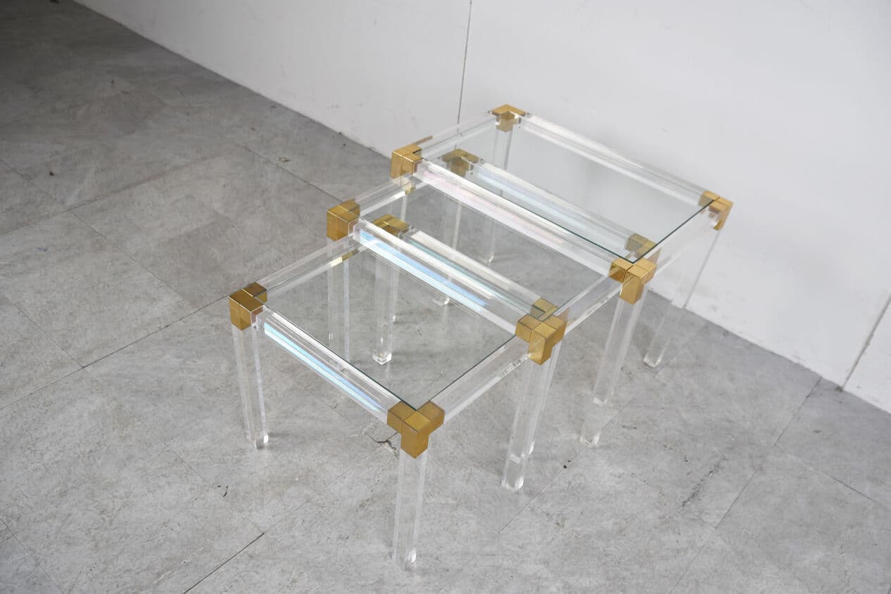 Set of three nesting tables, transparent lucite, brass, glass, Belgium, 1970s. - 329413