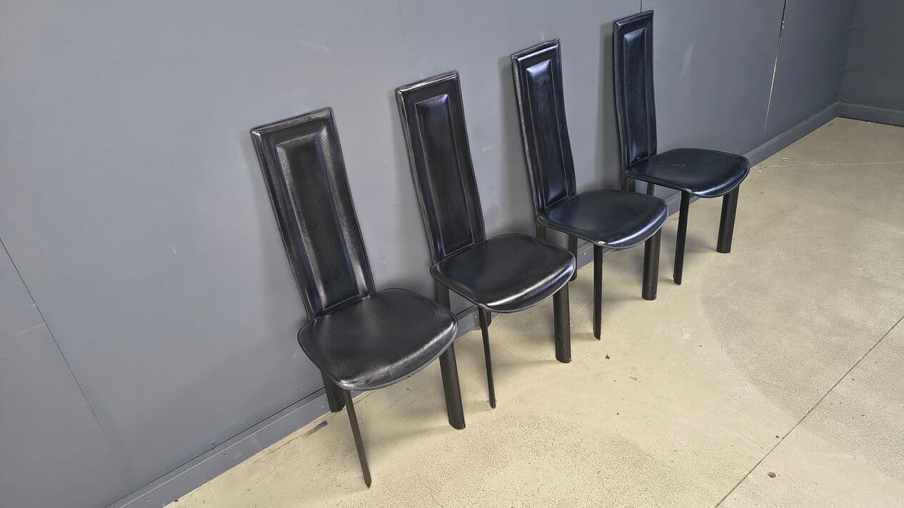 Set of four dining chairs, black leather, Italy, 1980s. - 328844