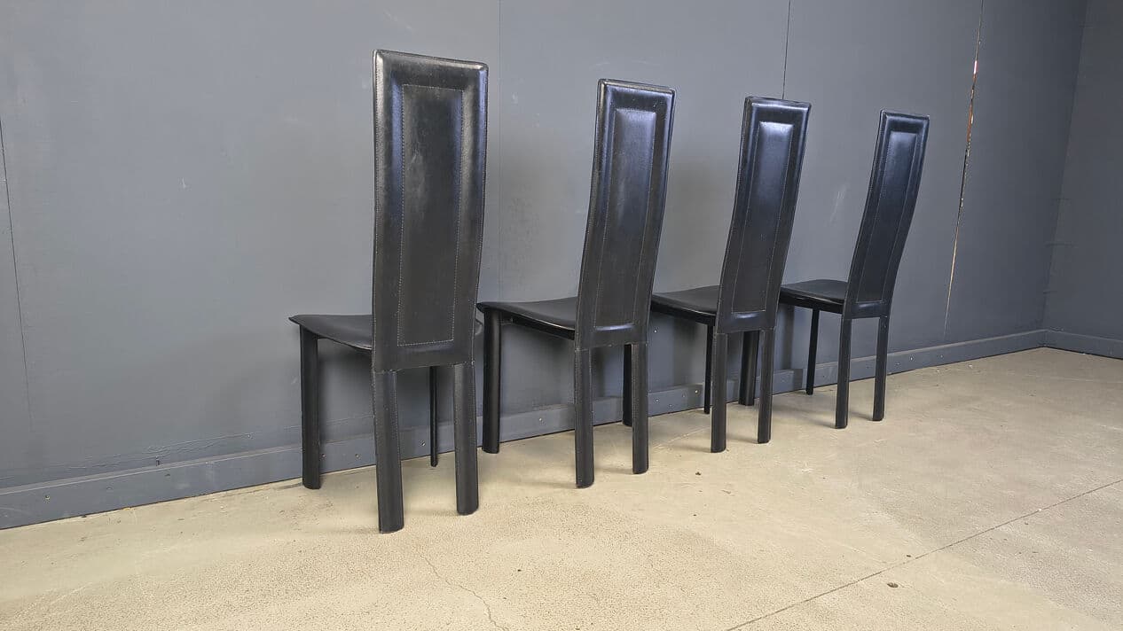 Set of four dining chairs, black leather, Italy, 1980s. - 328841