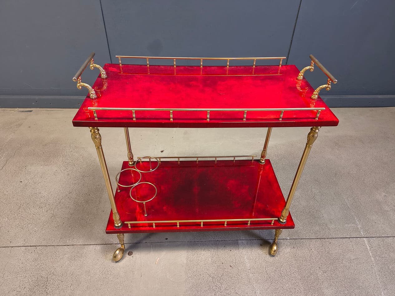 Bar cart, burgundy lacquered goatskin, gold metal, by A. Tura, Italy, 1970s. - 328771