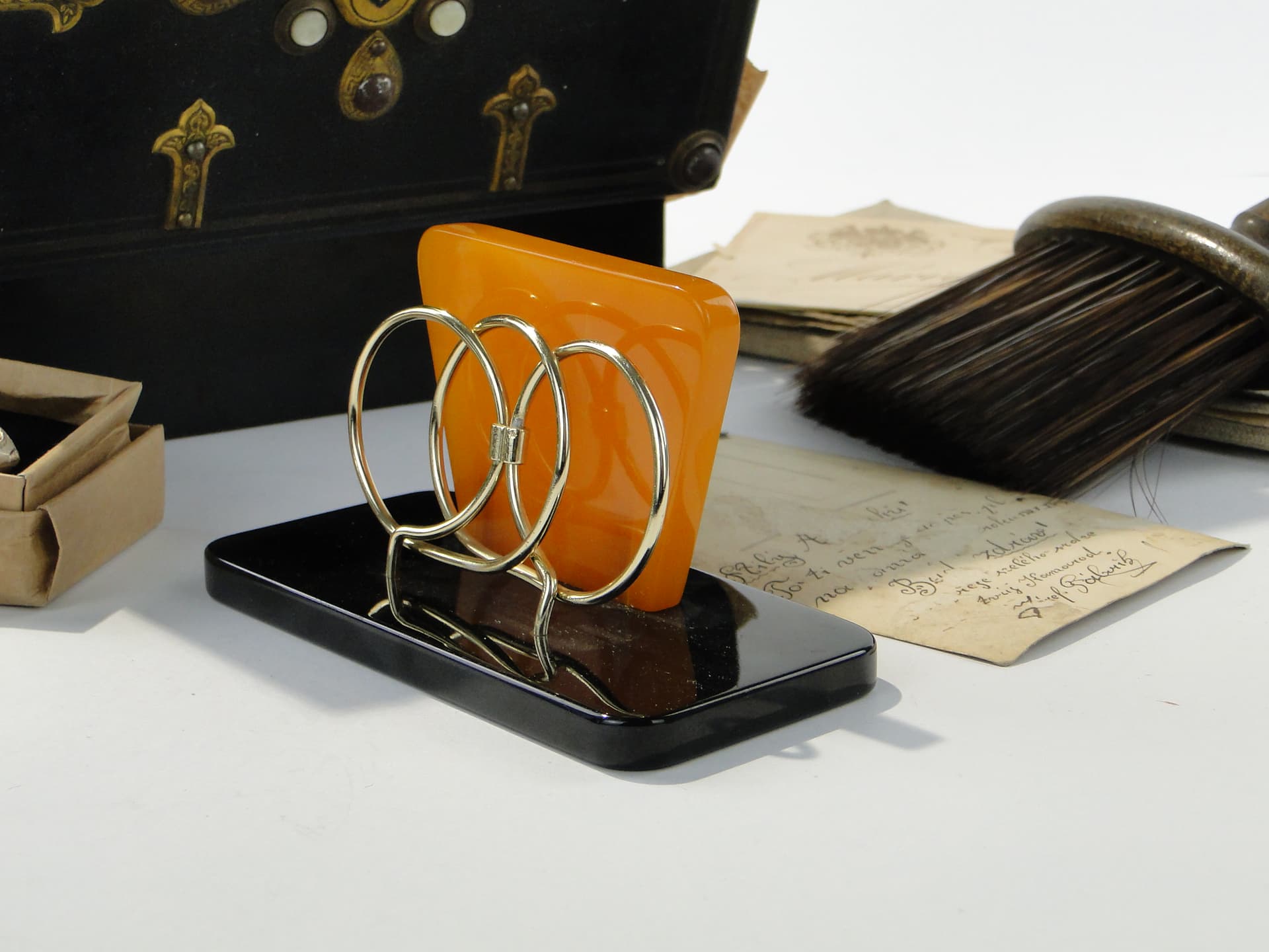 Napkin Holder, black and orange Bakelite, gold brass, Switzerland, 1960s. - 332845