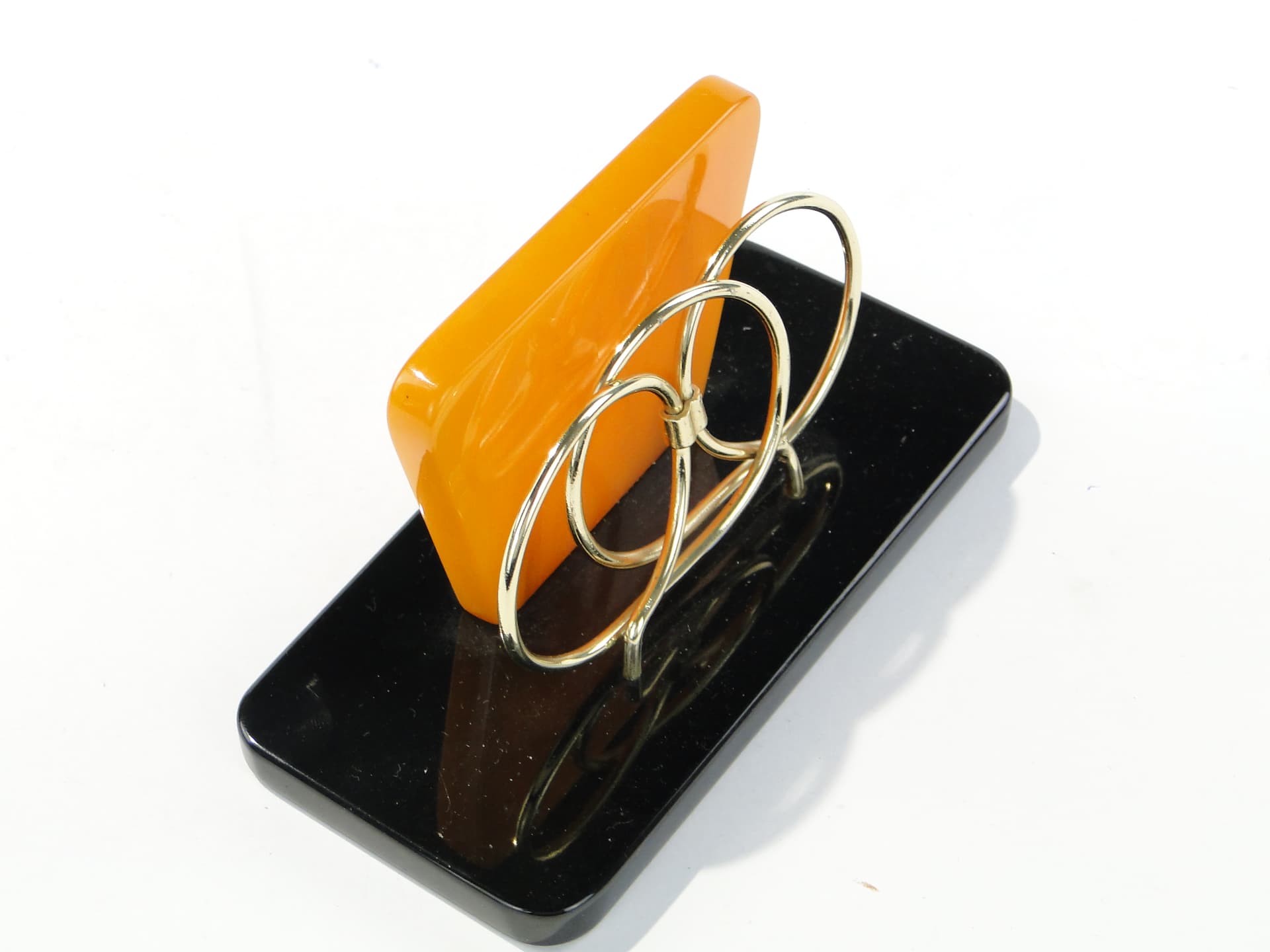 Napkin Holder, black and orange Bakelite, gold brass, Switzerland, 1960s. - 332850