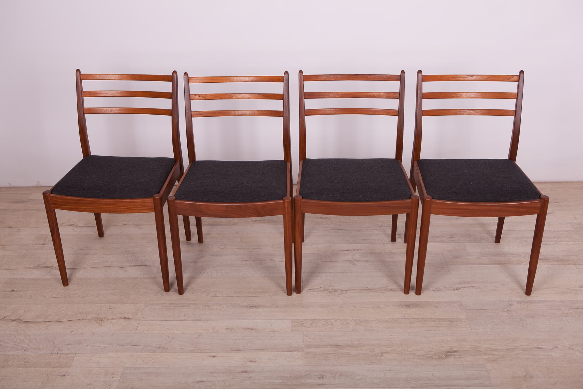 Set of four chairs, brown teak, black synthetic fabric, by V. Wilkins, G-Plan, United Kingdom, 1960s. - 333014
