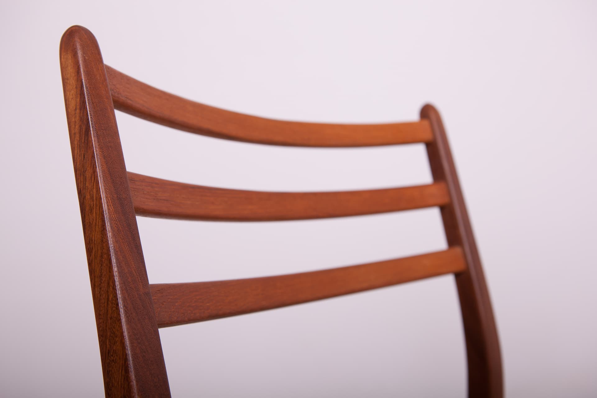 Set of four chairs, brown teak, black synthetic fabric, by V. Wilkins, G-Plan, United Kingdom, 1960s. - 333007