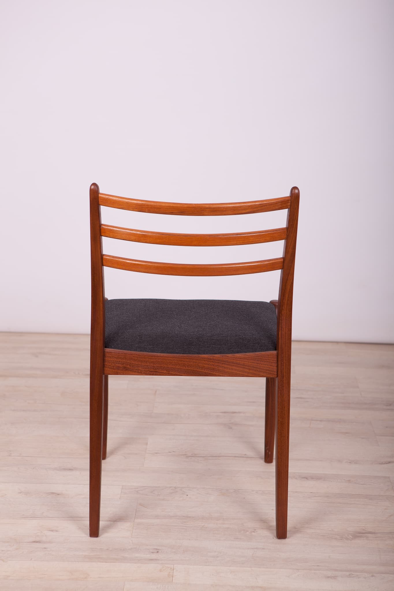 Set of four chairs, brown teak, black synthetic fabric, by V. Wilkins, G-Plan, United Kingdom, 1960s. - 333012