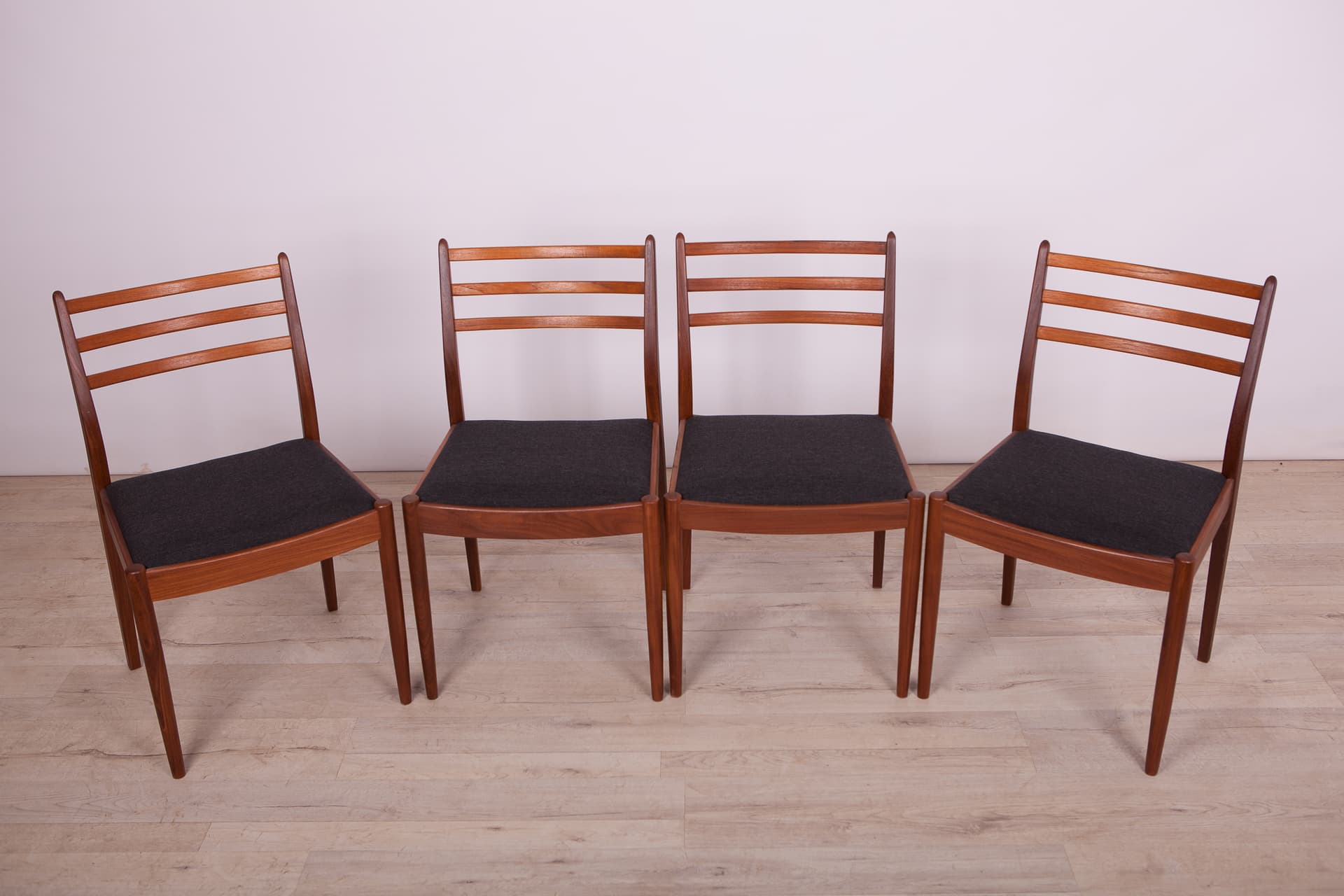 Set of four chairs, brown teak, black synthetic fabric, by V. Wilkins, G-Plan, United Kingdom, 1960s. - 333013