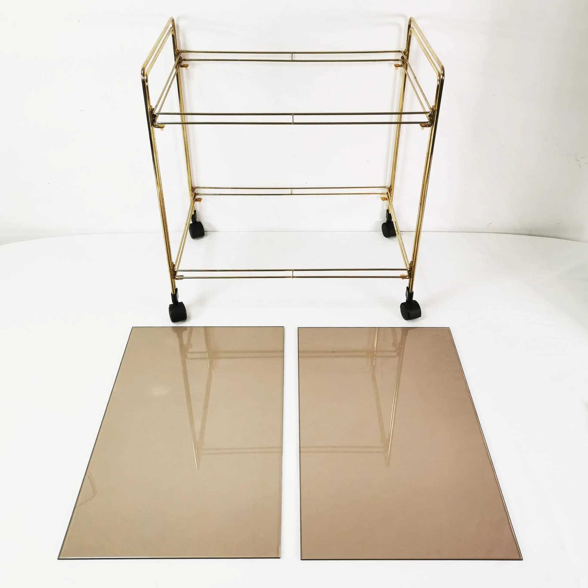 Bar cart minimalist, gold metal, smoked glass, Germany, 1970s. - 340631