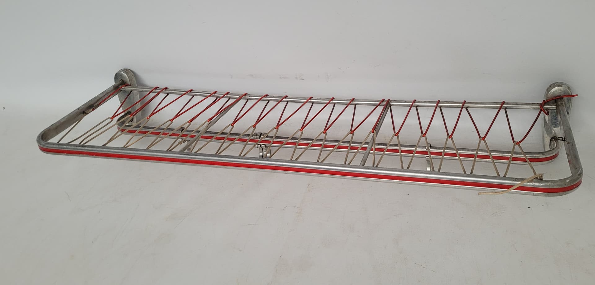 Wall-mounted rack, silver aluminium, red plastic, Germany, 1970s. - 343011