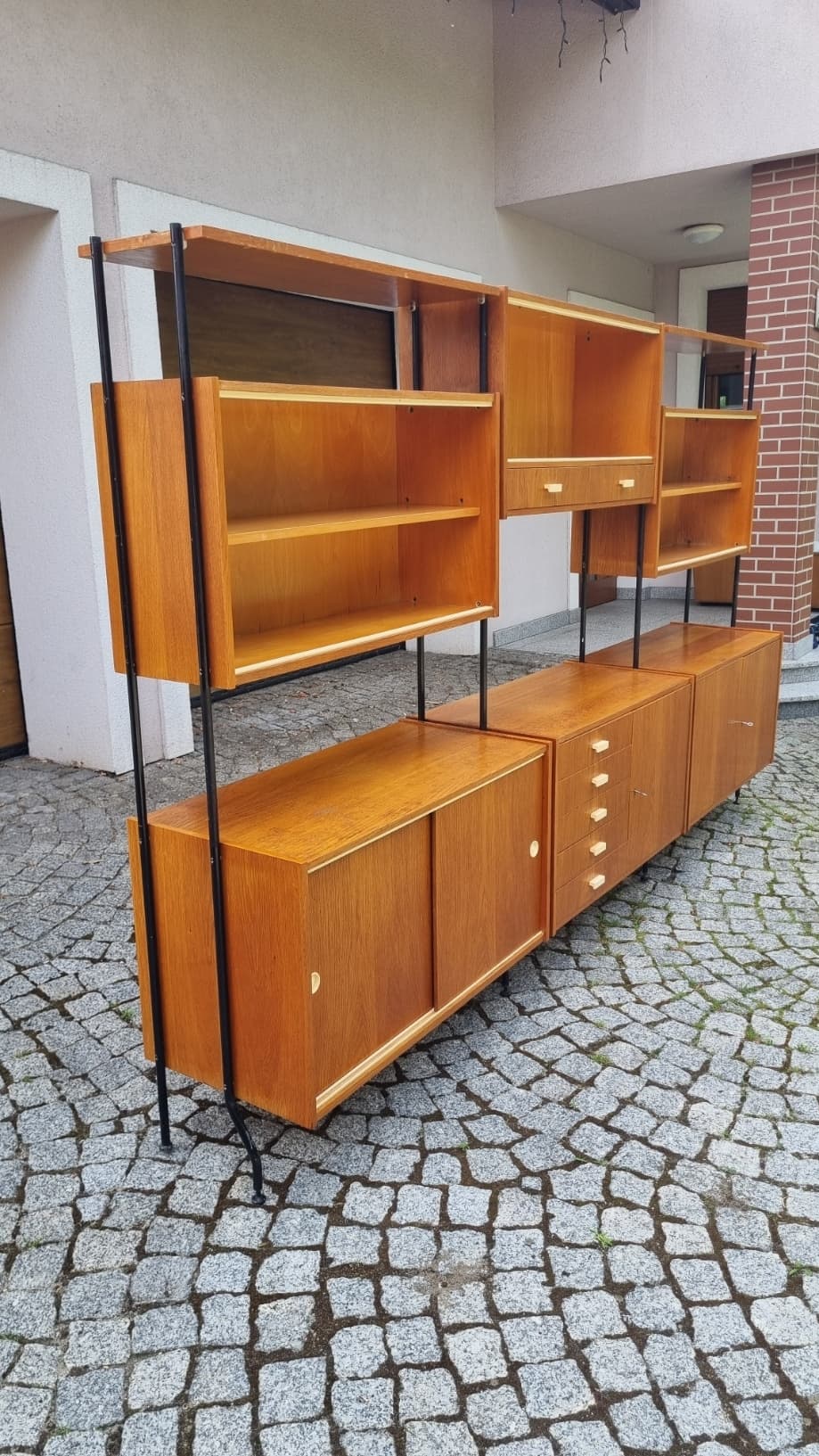 Modular shelving unit, brown wood veneer, black steel, Czechoslovakia, 1960s. - 346211