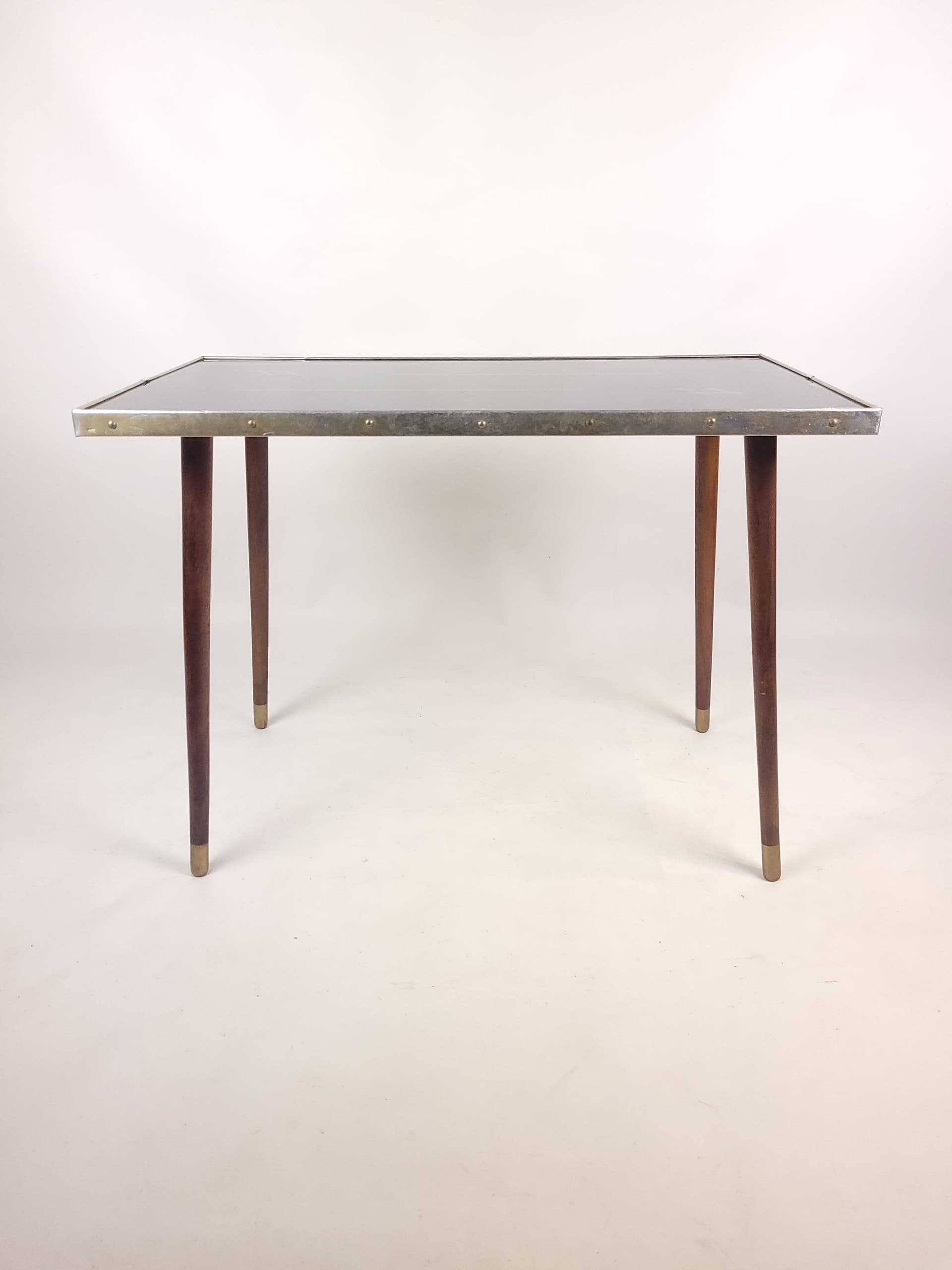 Coffee table, black top, brown wood, gold brass, 1960s. - 346238