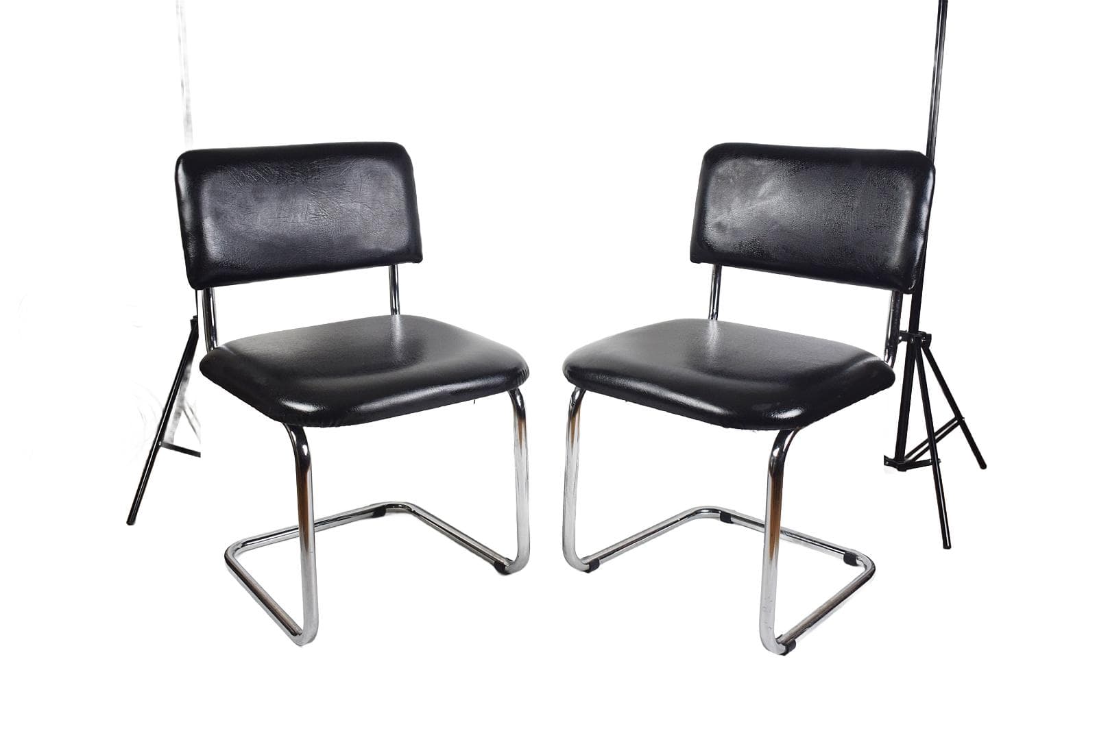 Pair of cantilever chairs, black faux leather, chromed steel, 1970s