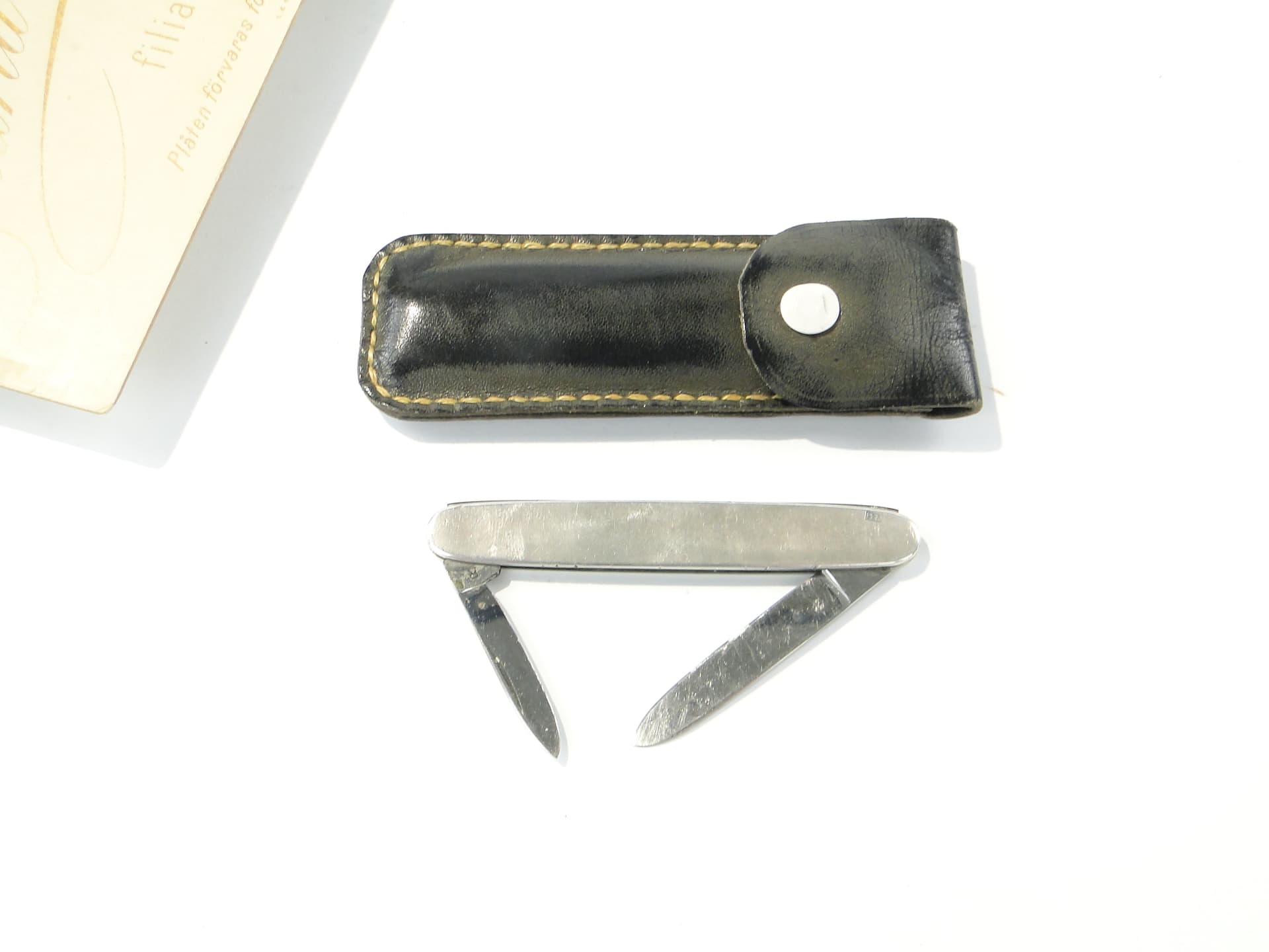 Pocket knife, silver, steel, black leather, United Kingdom, 1960s. - 346761