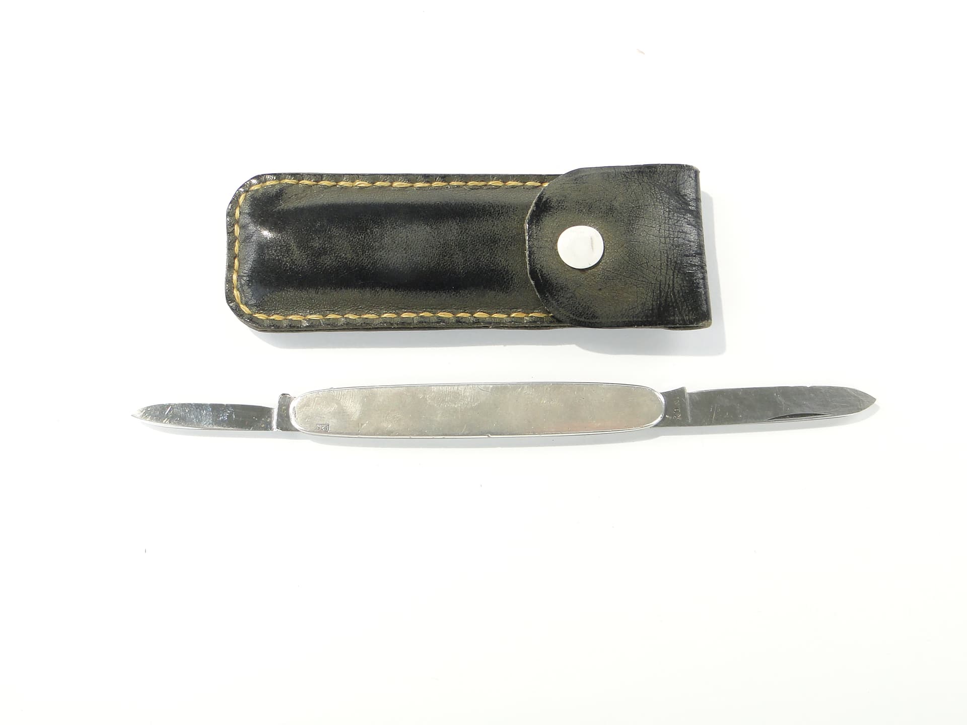 Pocket knife, silver, steel, black leather, United Kingdom, 1960s. - 346759