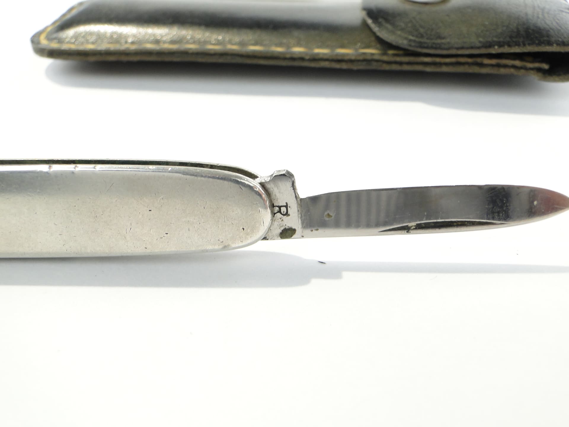Pocket knife, silver, steel, black leather, United Kingdom, 1960s. - 346763