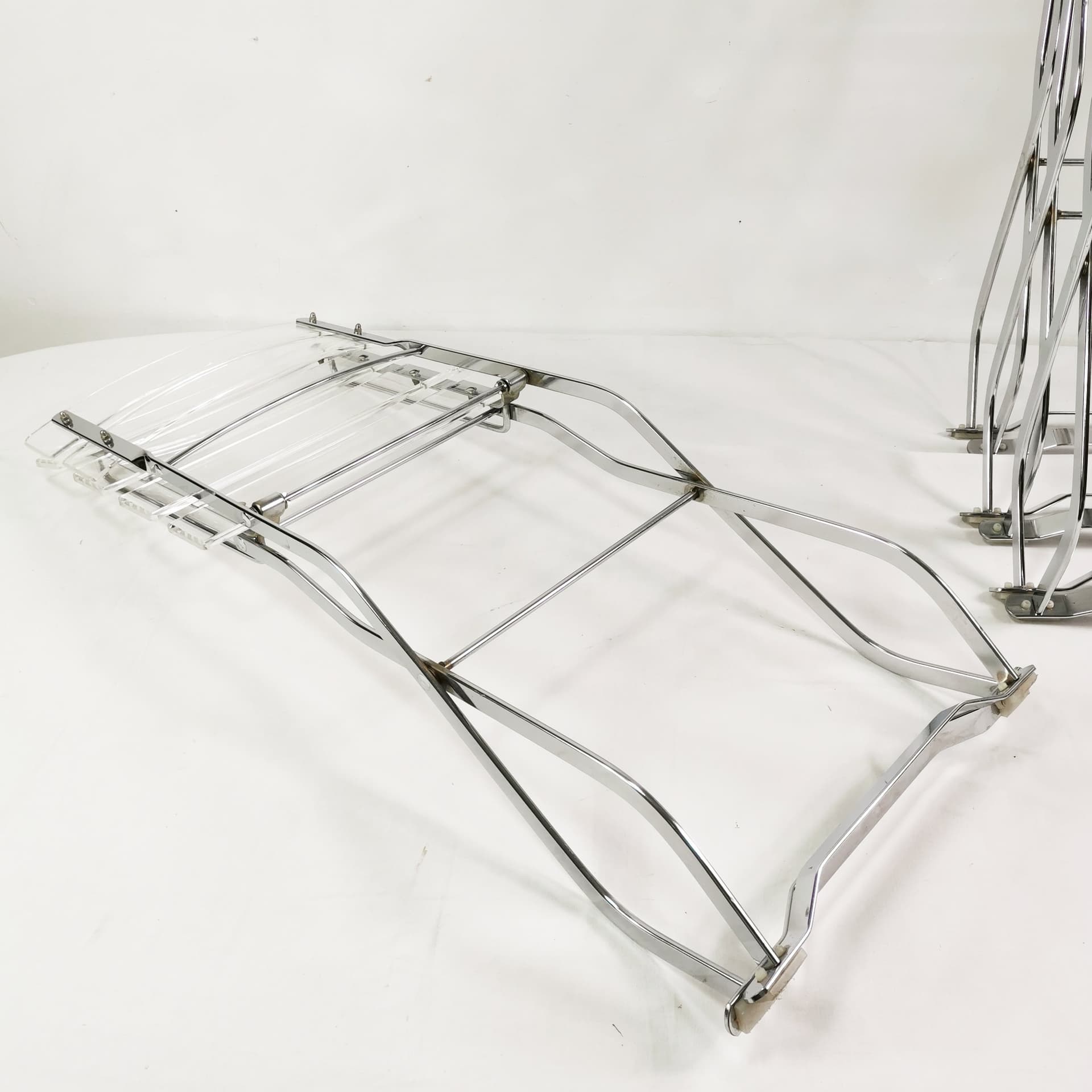 Set of four folding chairs, transparent plexiglass, silver metal, France, 1970s. - 347519