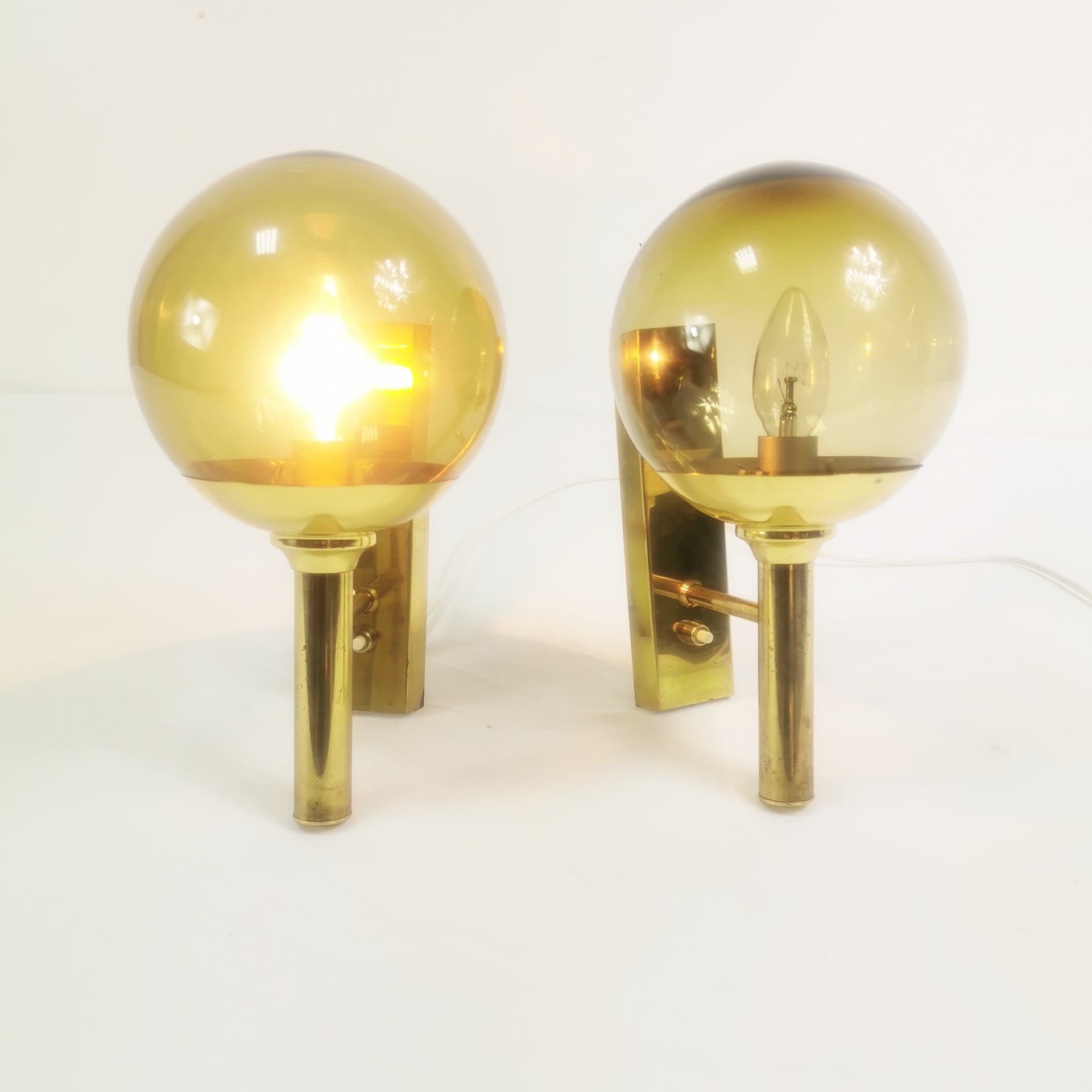 Pair of wall sconces Mid Century, gold brass, smoked glass, by Sv. Mejlstrøm, Mejlstrøm Belysning, Norway, 1960s. - 349722