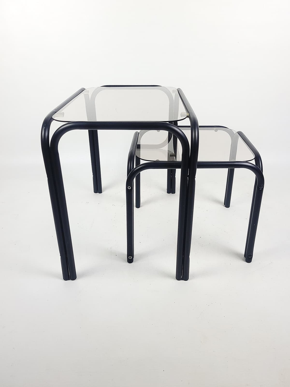 Set of two coffee tables, grey glass, black metal, 1980s. - 352774