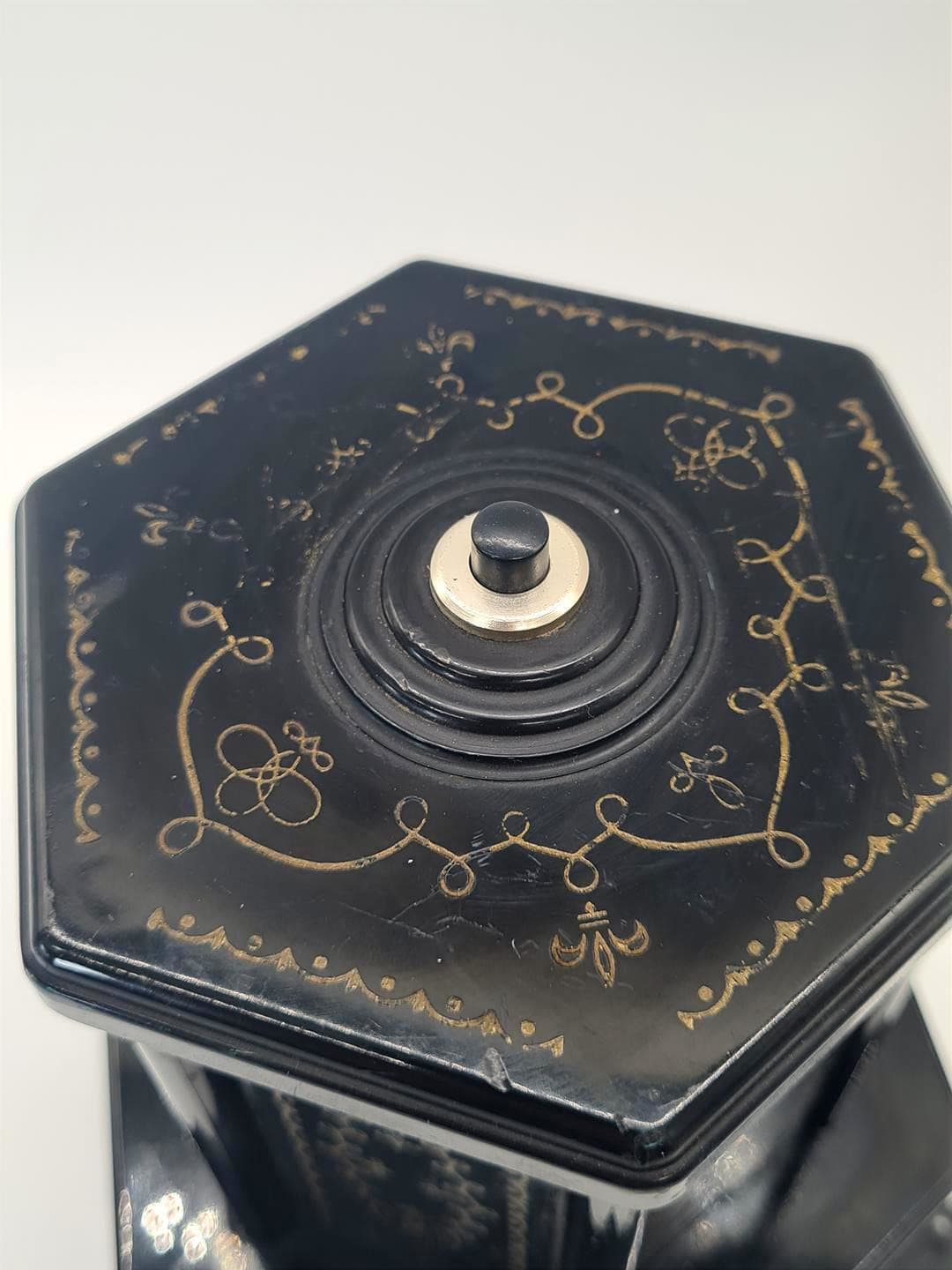 Cigarette dispenser with music box, black gold plastic, Selcol, England, 1960s. - 357213