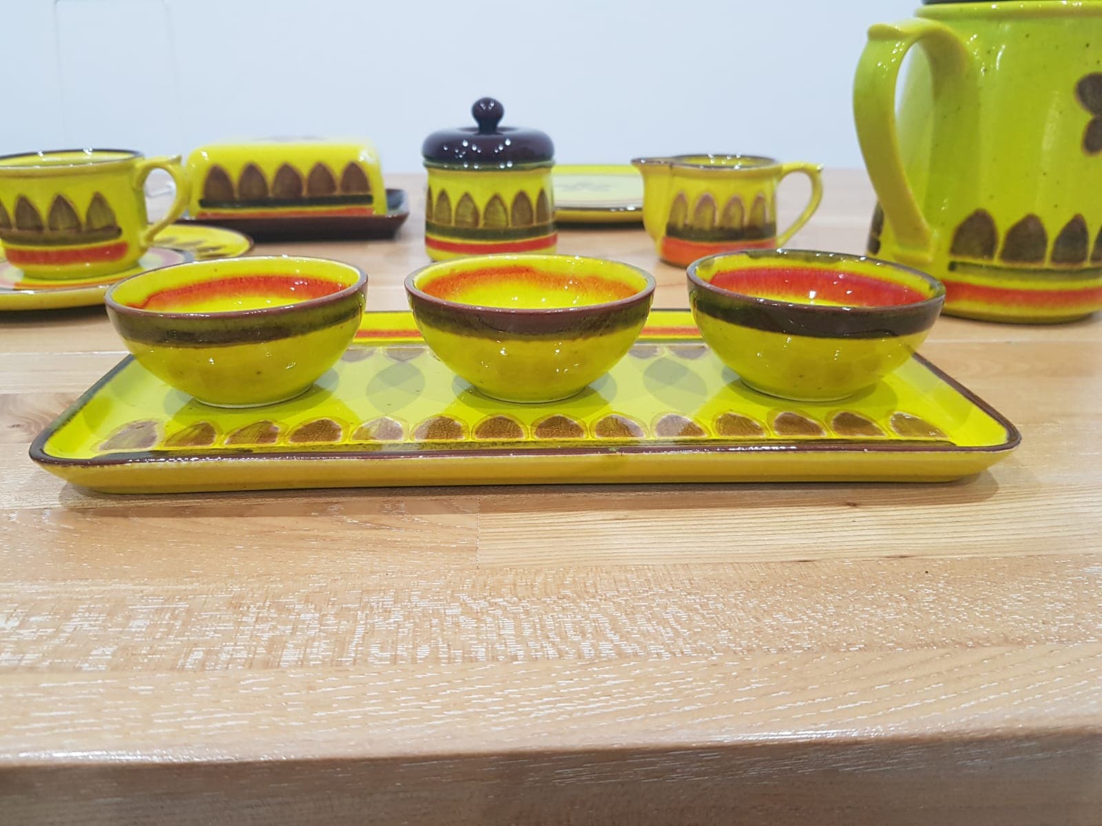 Twenty-five piece dinnerware set, yellow brown orange ceramic, Zell am Harmersbach, Germany, 1980s. - 360864