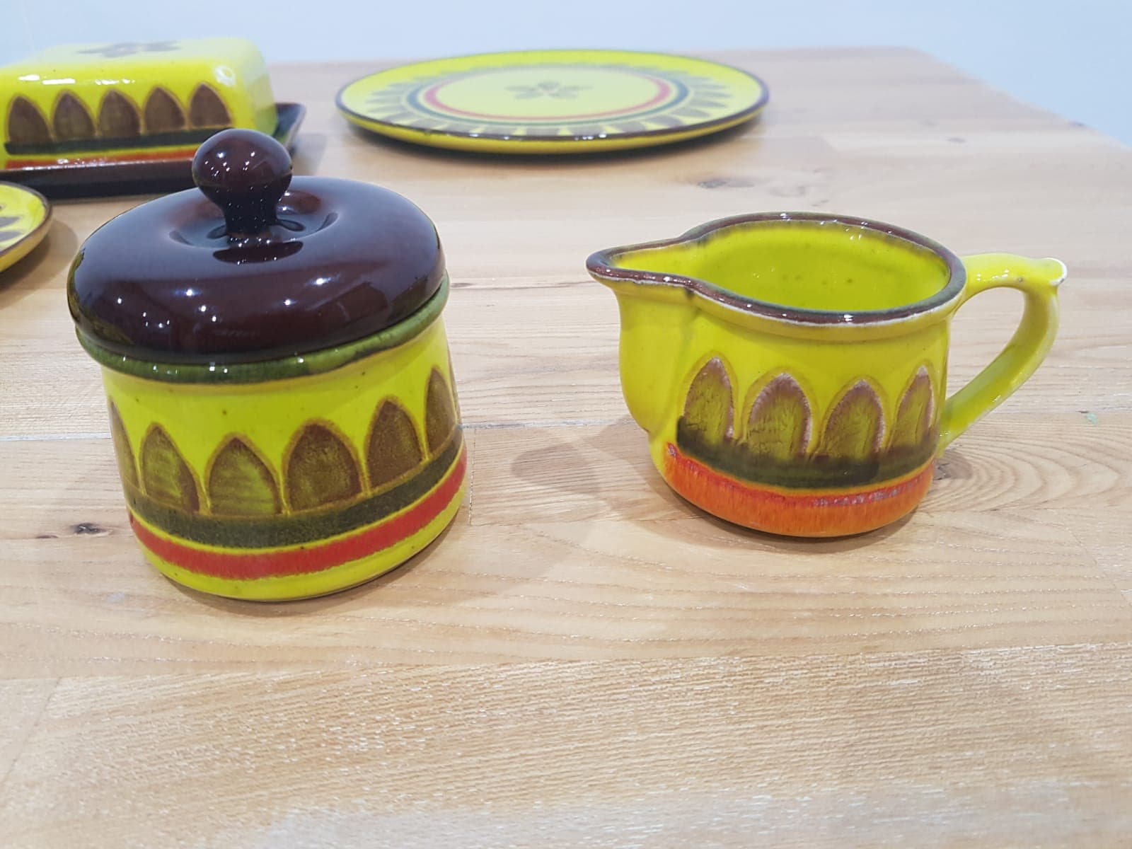 Twenty-five piece dinnerware set, yellow brown orange ceramic, Zell am Harmersbach, Germany, 1980s. - 360871