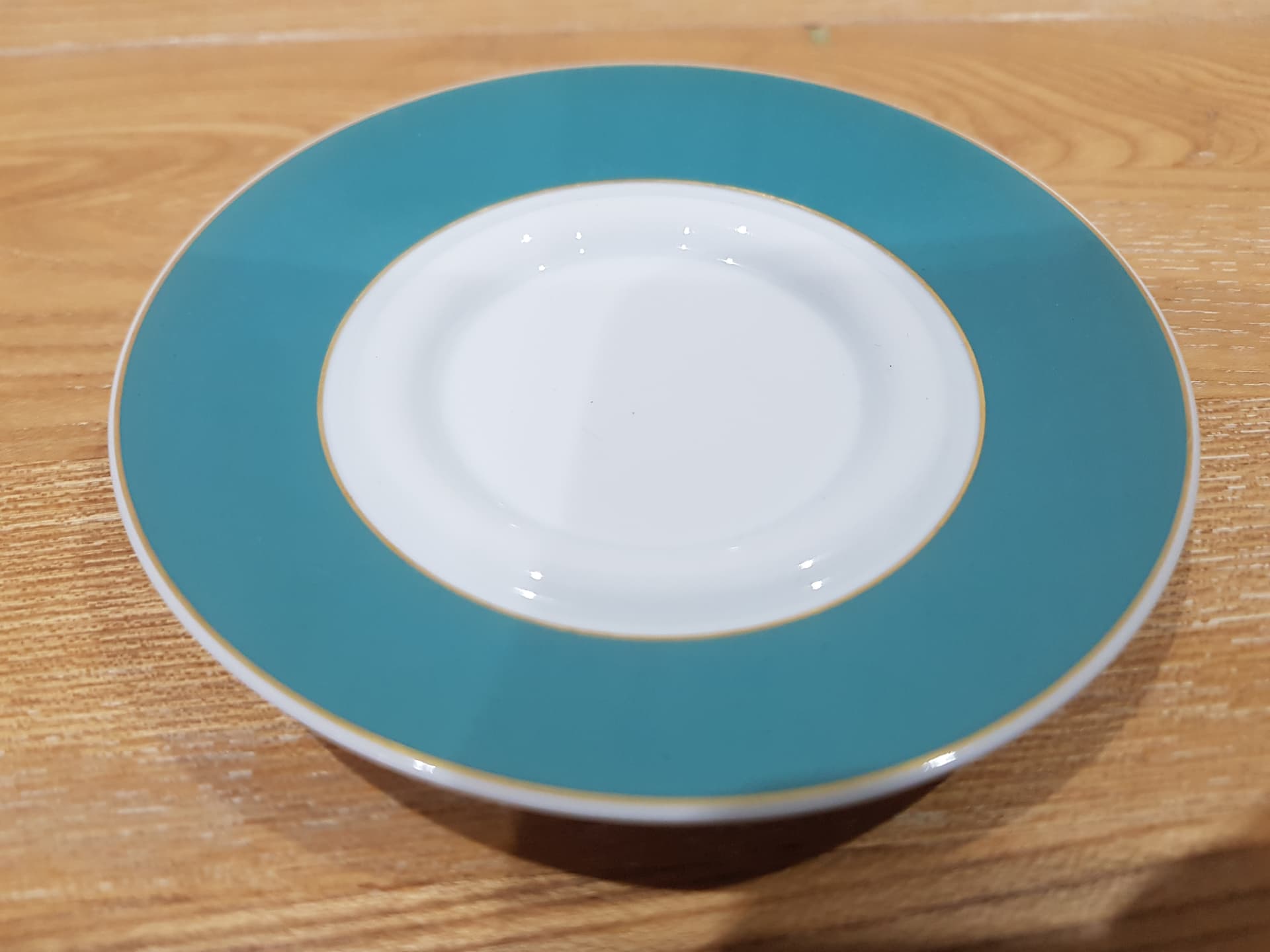 Set of two espresso saucers, turquoise white gold, porcelain, by B. Wiinblad, Germany, 1980s. - 360877