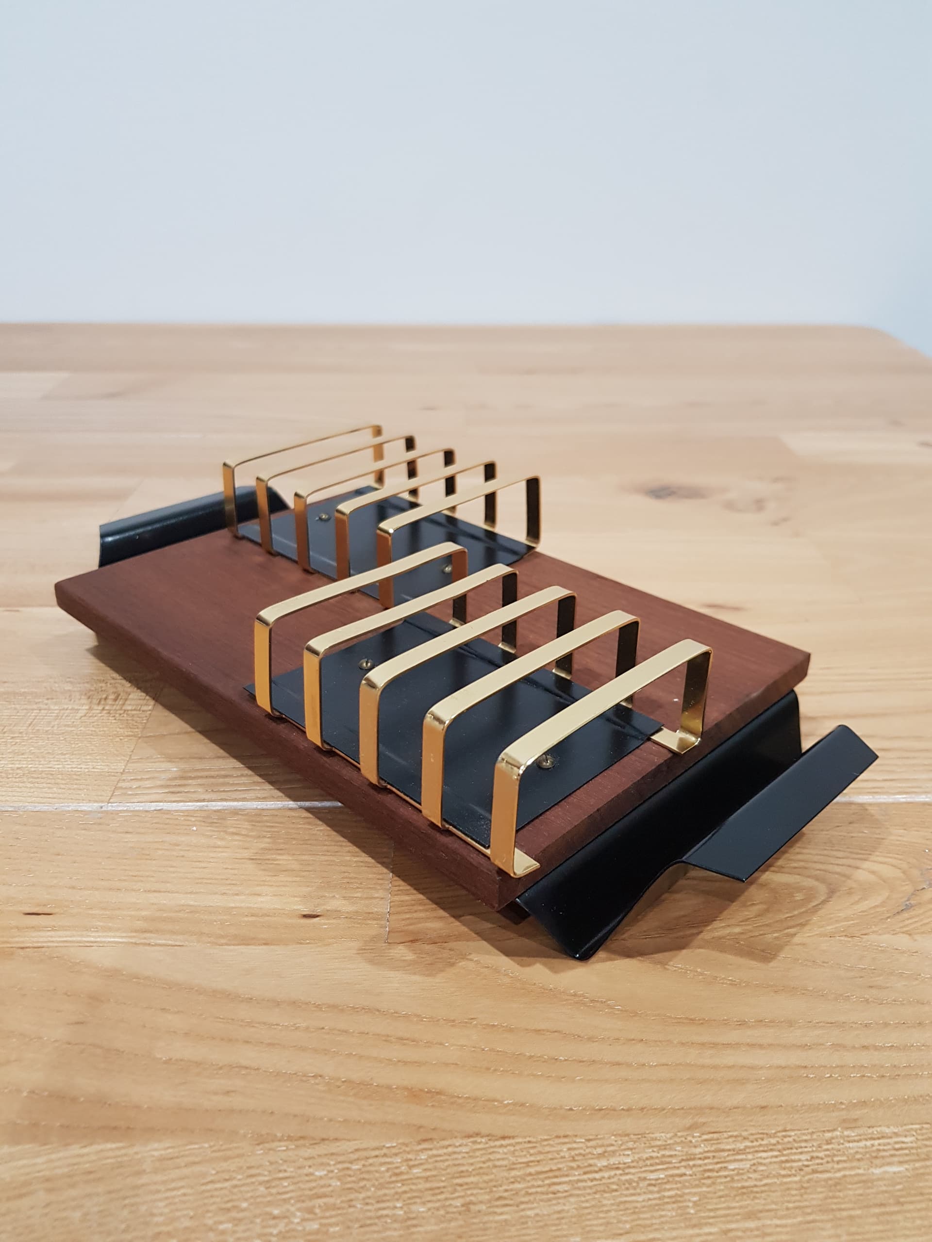 Toast rack, brown teak, golden brass, black metal, Denmark, 1960s. - 362481