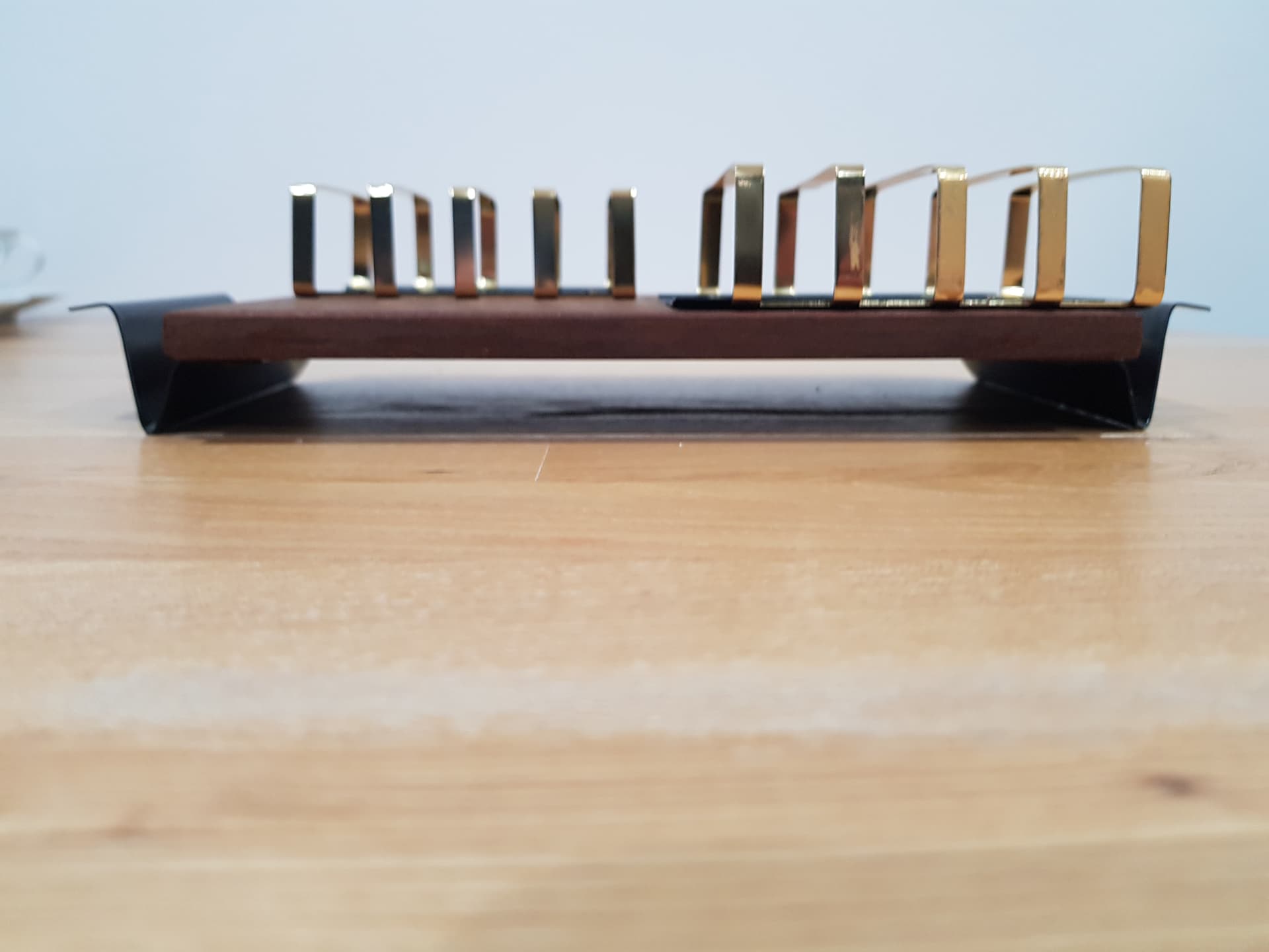 Toast rack, brown teak, golden brass, black metal, Denmark, 1960s. - 362479
