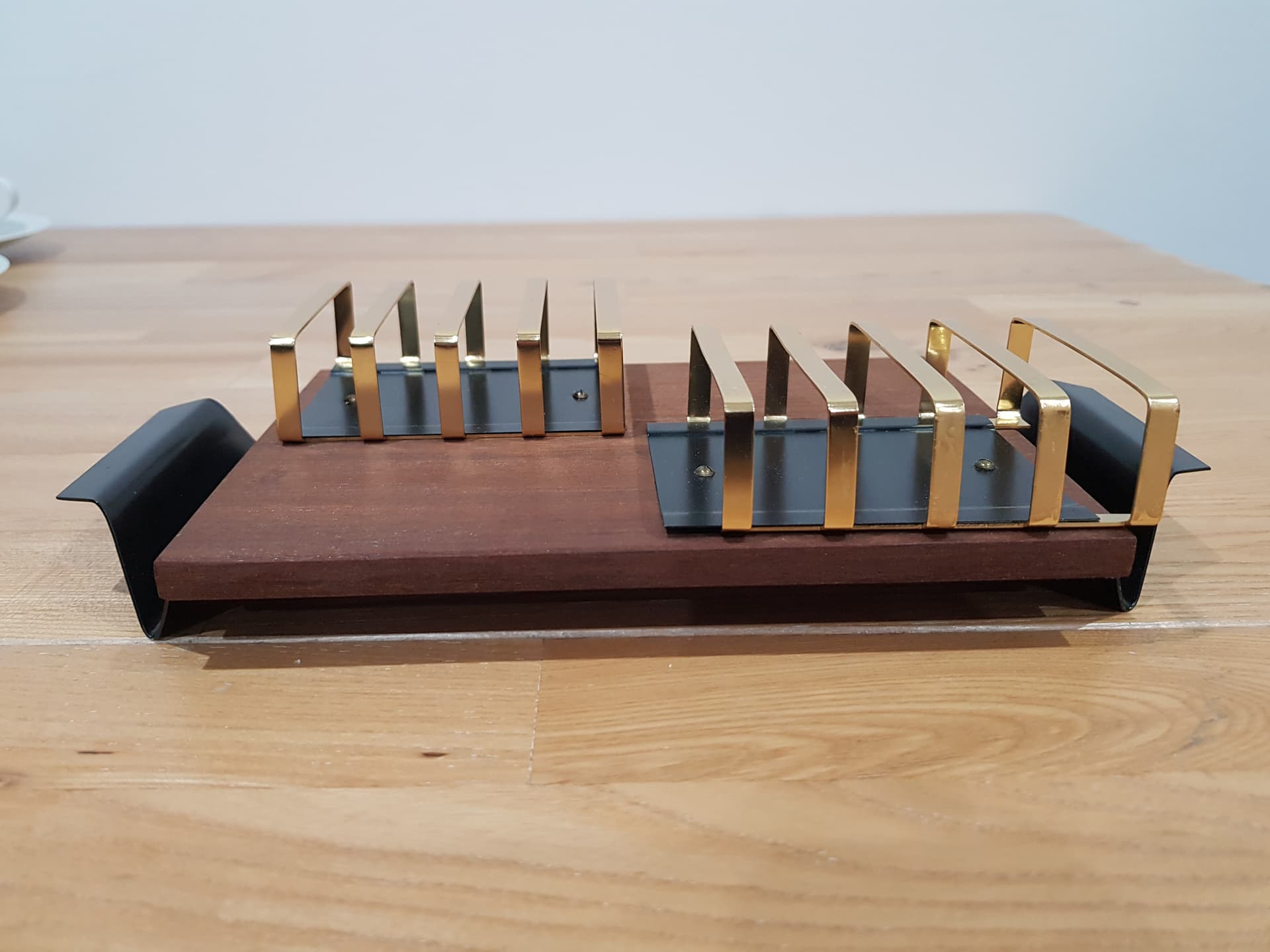 Toast rack, brown teak, golden brass, black metal, Denmark, 1960s. - 362477