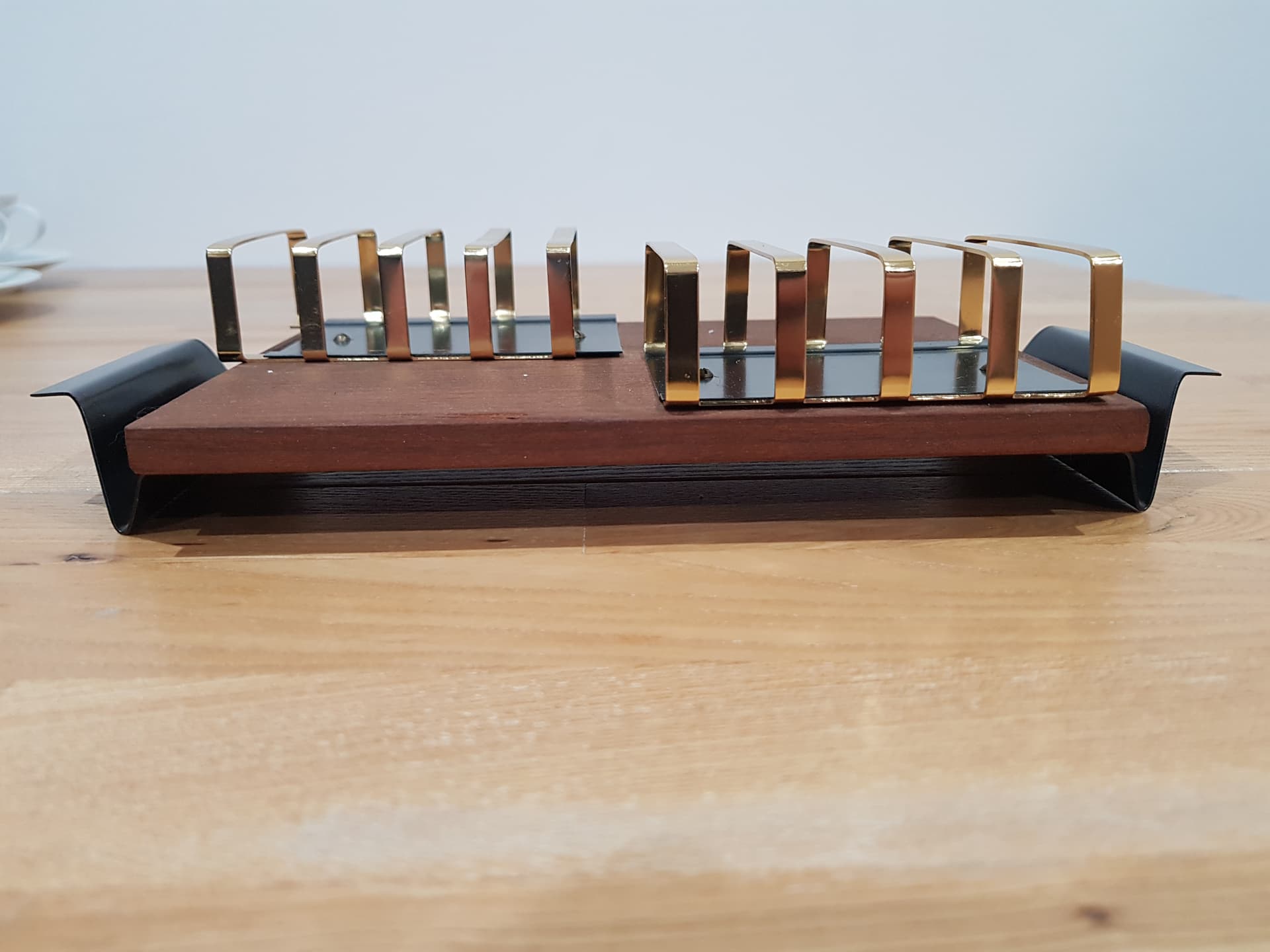 Toast rack, brown teak, golden brass, black metal, Denmark, 1960s. - 362478