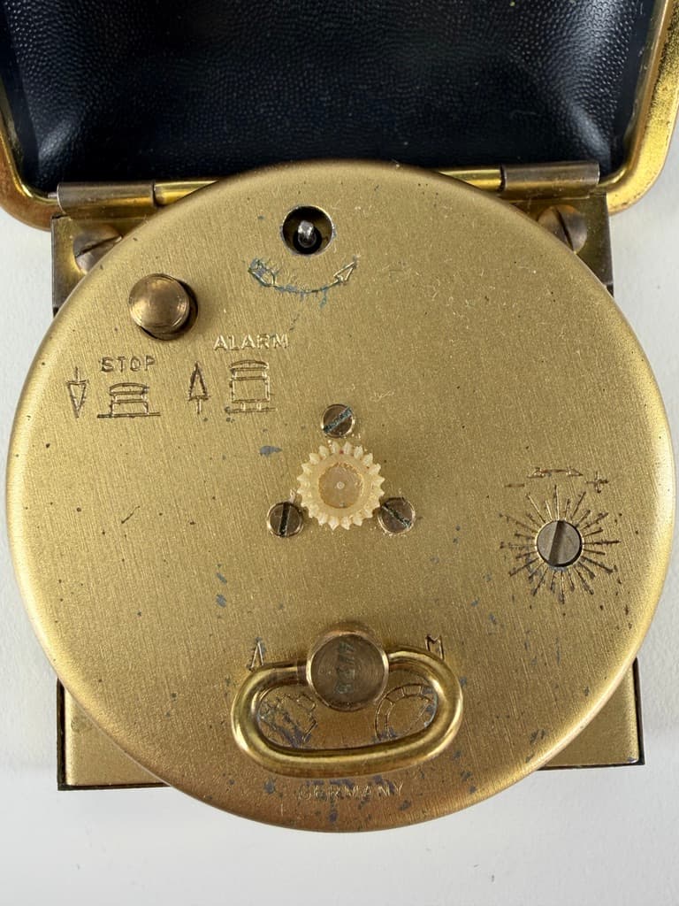 Set of two travel clocks, Junghans & Jerger, gold brass, black and burgundy faux leather, Germany, 1960s. - 364765