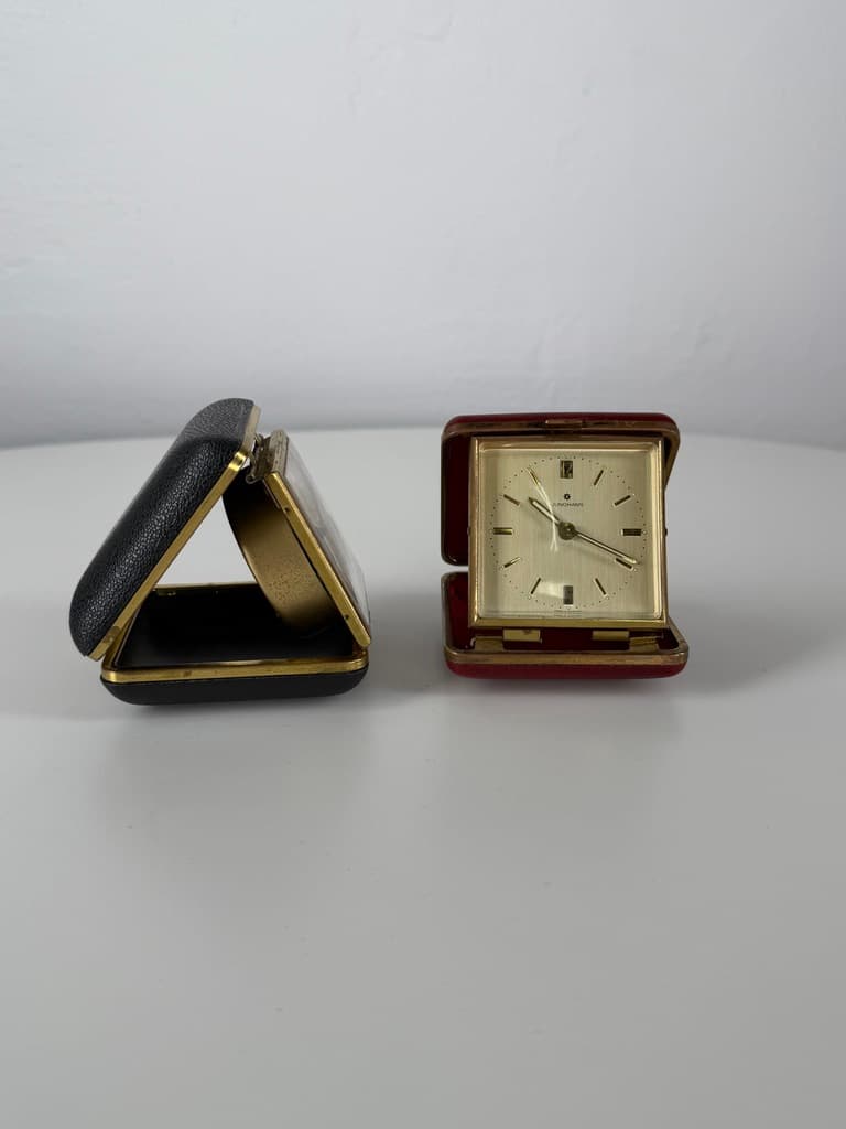 Set of two travel clocks, Junghans & Jerger, gold brass, black and burgundy faux leather, Germany, 1960s. - 364758