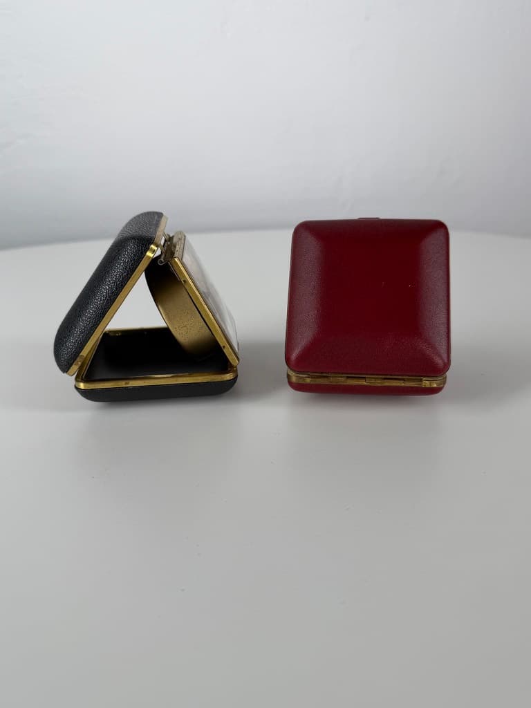 Set of two travel clocks, Junghans & Jerger, gold brass, black and burgundy faux leather, Germany, 1960s. - 364759